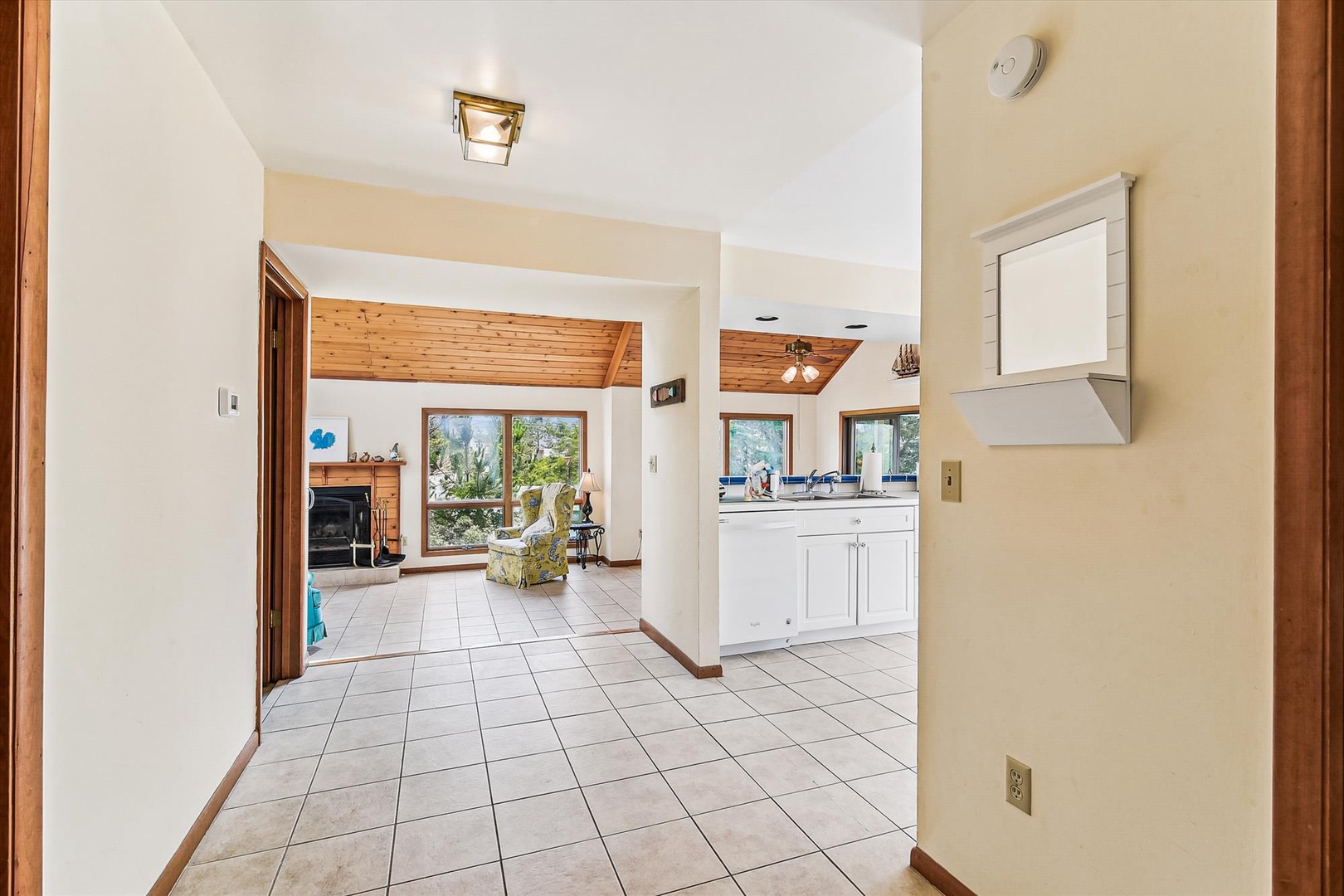 Step inside to discover a bright, airy layout that flows seamlessly from room to room, with warm wood accents and ample natural light creating a welcoming, homey atmosphere.
