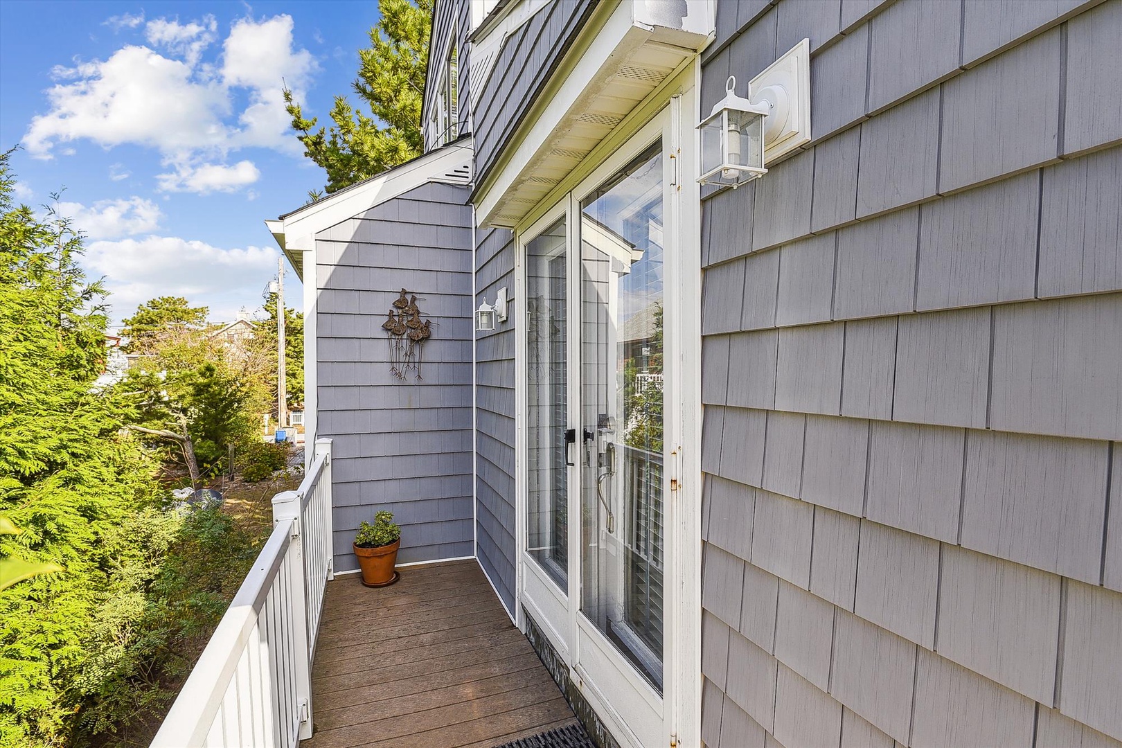 Charming private balcony with tree-lined views—your peaceful outdoor spot to unwind, sip morning coffee, or enjoy the gentle breeze and sunshine surrounded by nature.