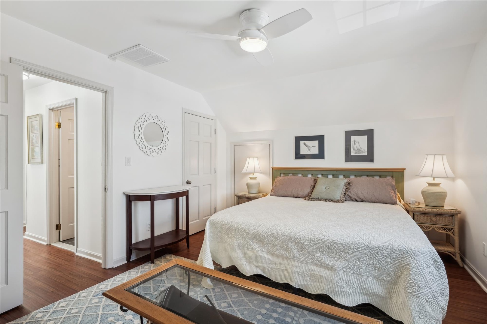 Relax in your peaceful bedroom with crisp linens, soft lighting, and a ceiling fan to keep you comfortable all night long.