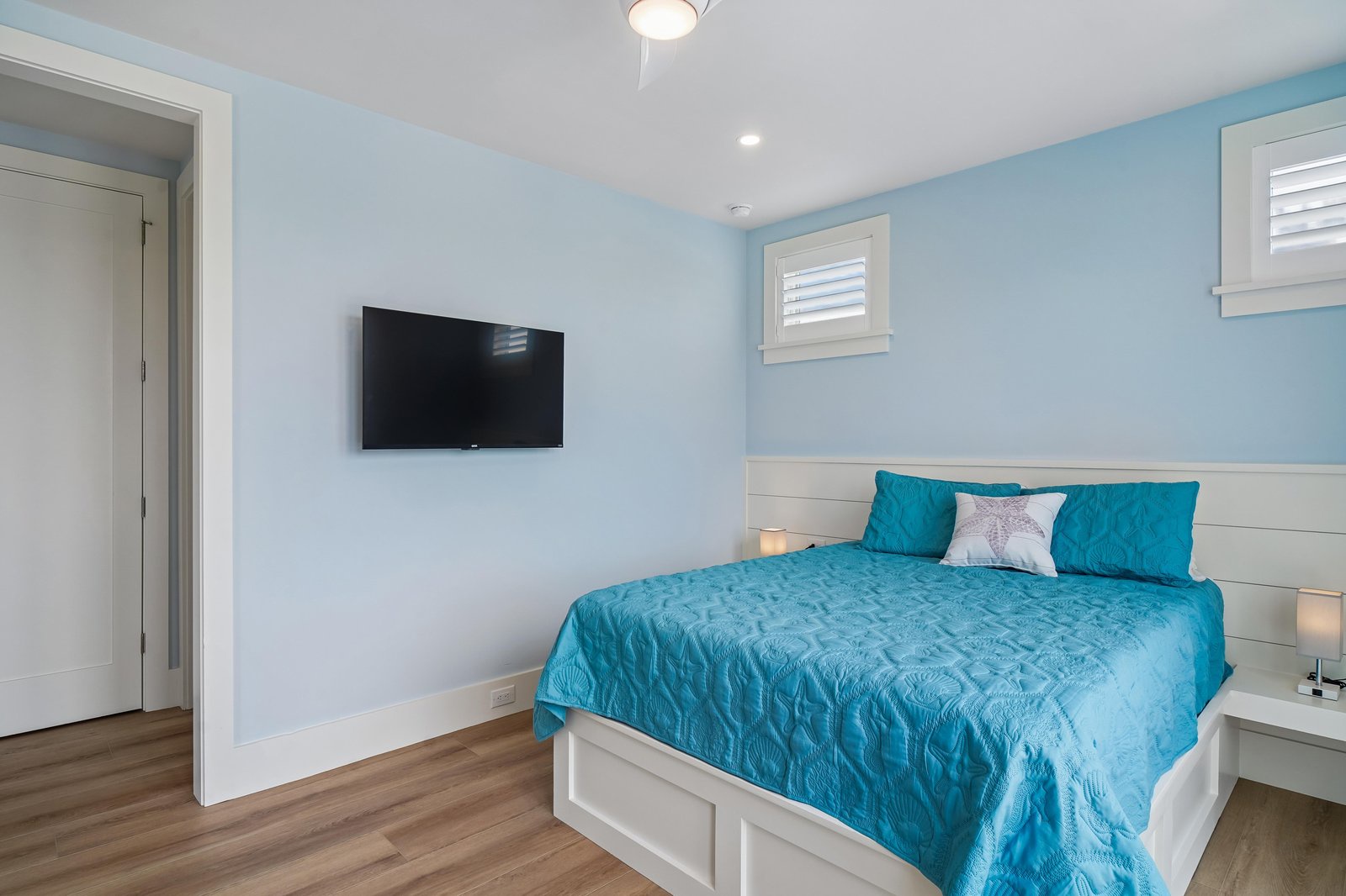 Your coastal-inspired bedroom awaits with soothing ocean hues and crisp white accents. Sink into the plush bed after a day of adventure, catch up on your favorite shows, or simply relax in this serene retreat.