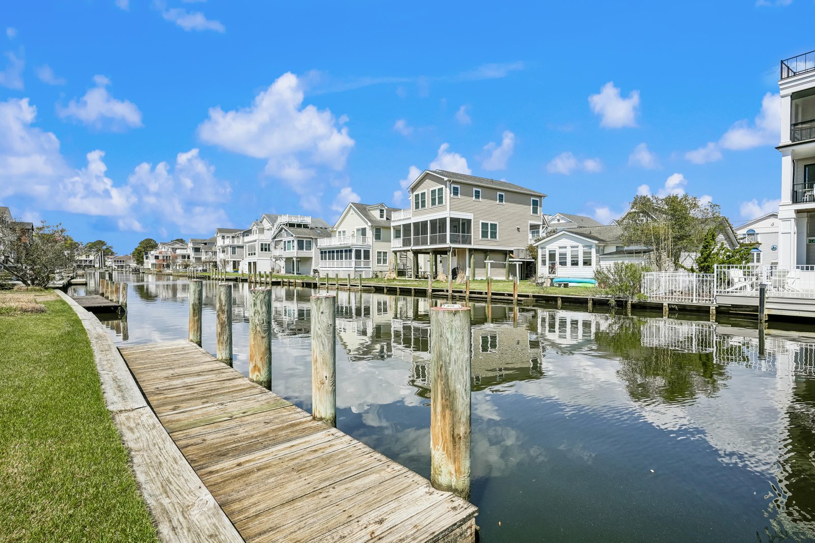 Waterfront community featuring private docks and serene canal access, ideal for boating enthusiasts and waterside living.