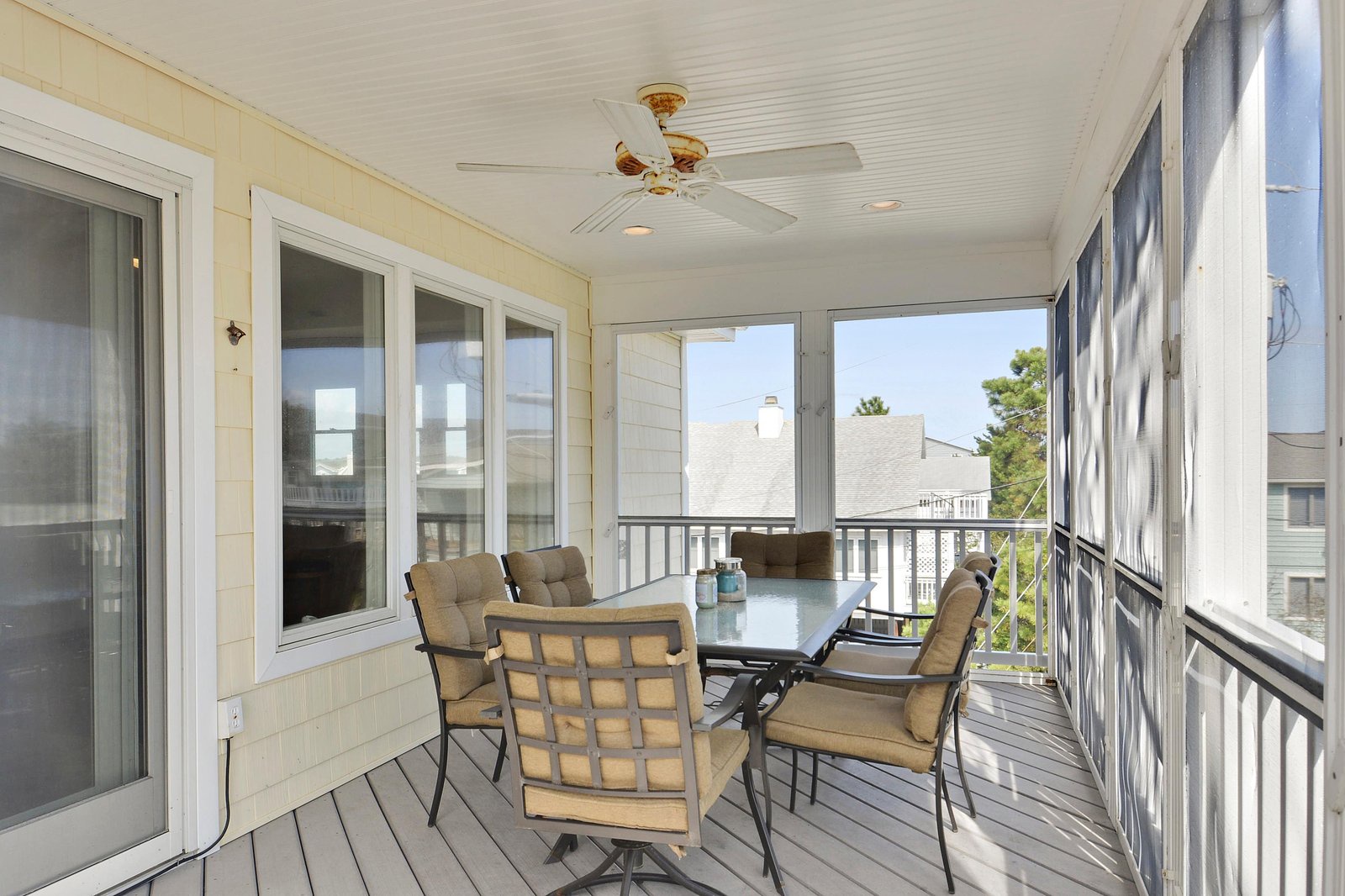 Picture yourself unwinding here with morning coffee or evening drinks. The cushioned chairs invite you to linger while gentle breezes and natural light create your private retreat.