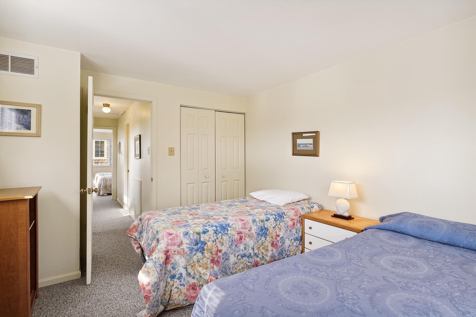 Drift off to sleep in this cozy bedroom with twin beds, soft linens, and plenty of closet space for your belongings. A peaceful retreat awaits you after a day of adventure.