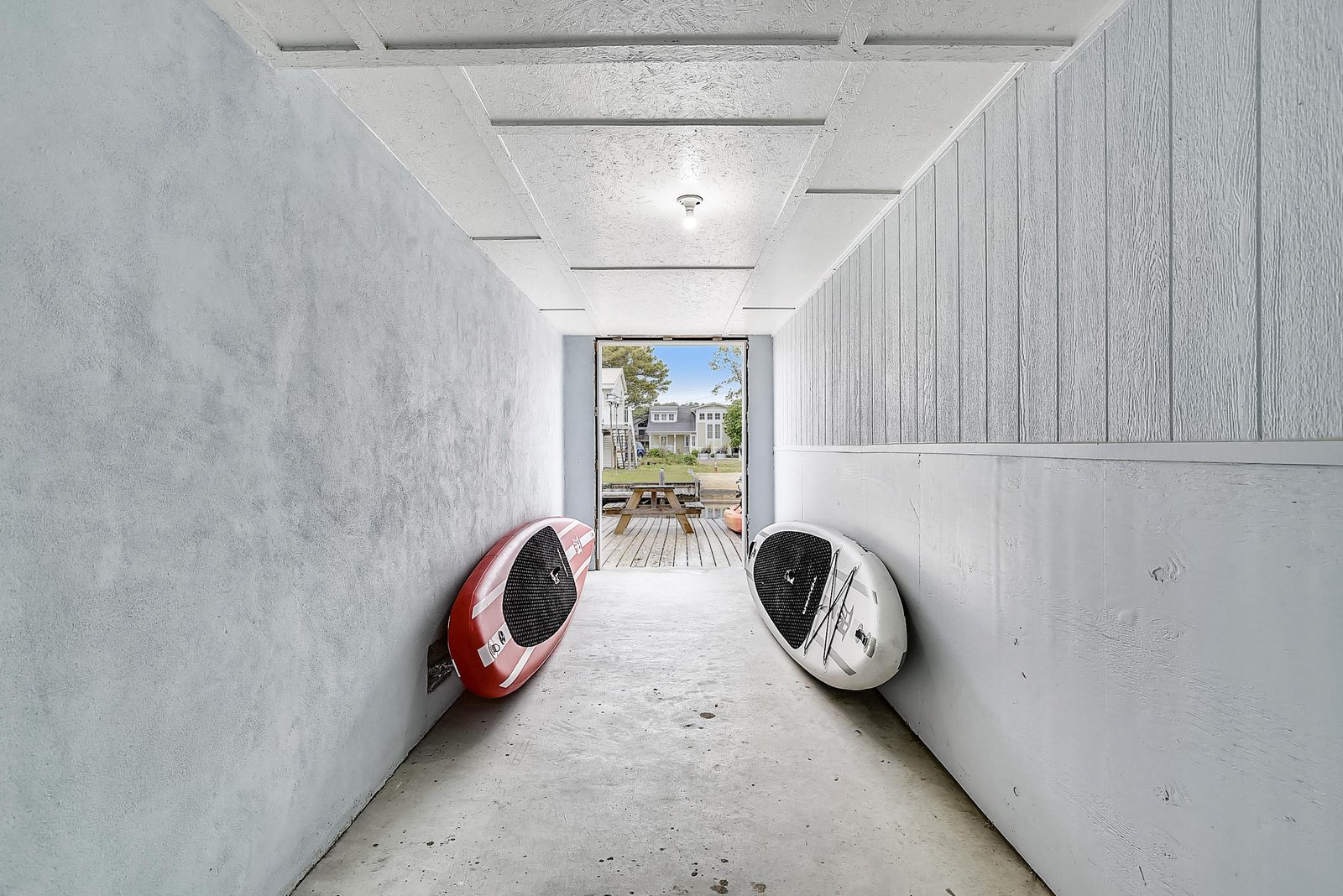 Your paddleboards are stored in a secure hallway, ready for your next waterfront adventure.