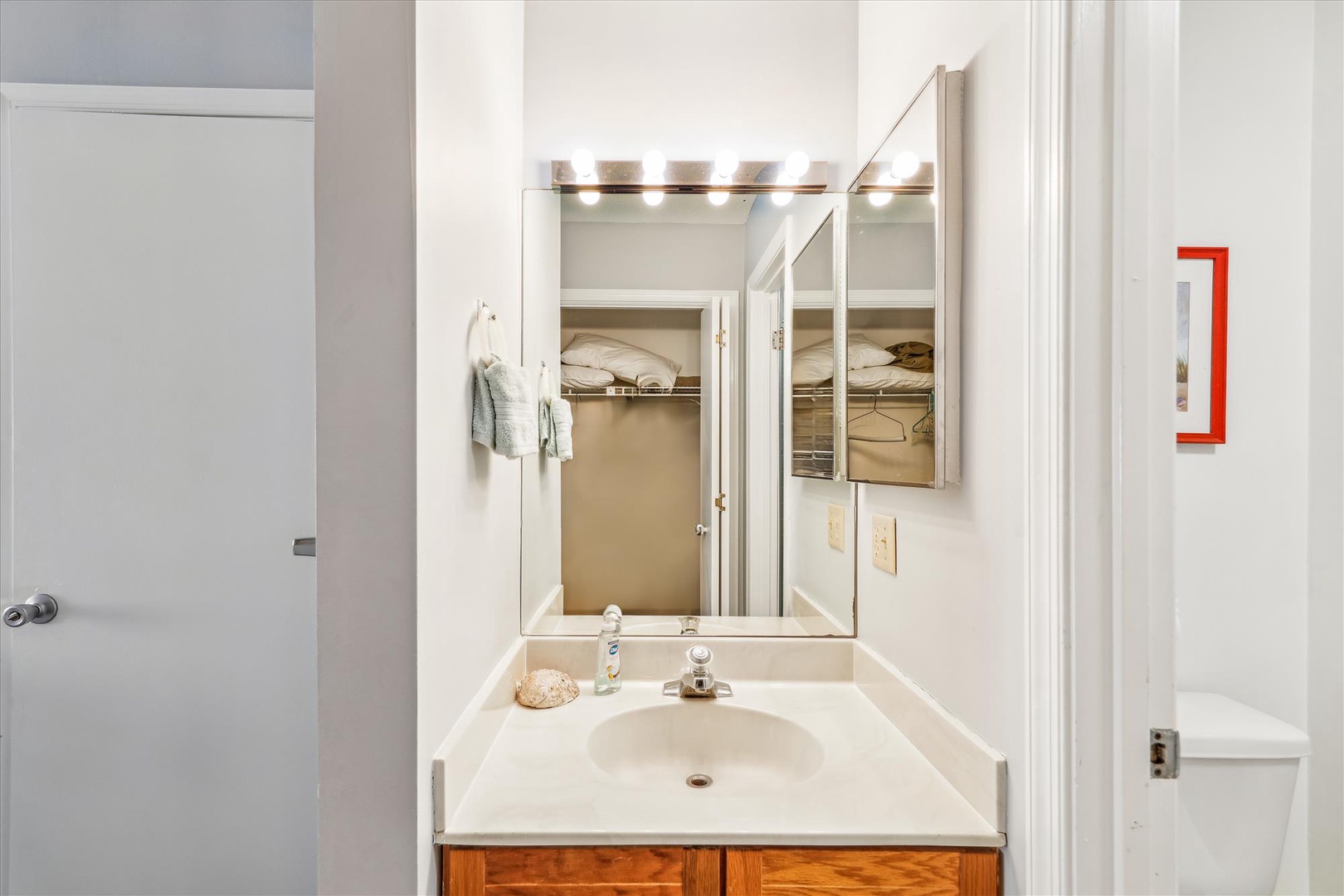 Freshen up at your private vanity with bright lighting and a mirrored medicine cabinet, plus linens and essentials within easy reach.