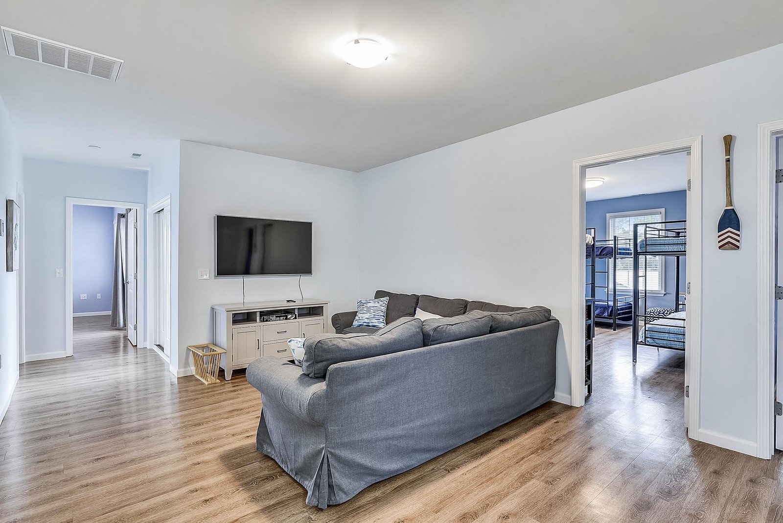 Settle in on the spacious sectional for movie nights or easy conversation. The open layout connects everyone, with bedrooms just steps away for a restful night's sleep.