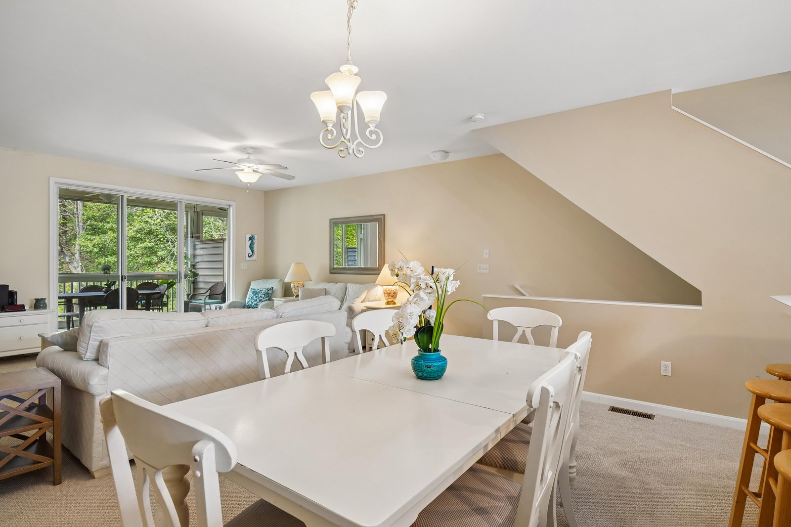 Bright, open-plan living and dining space where you'll gather for meals and relaxation, with patio doors opening to your private outdoor retreat.