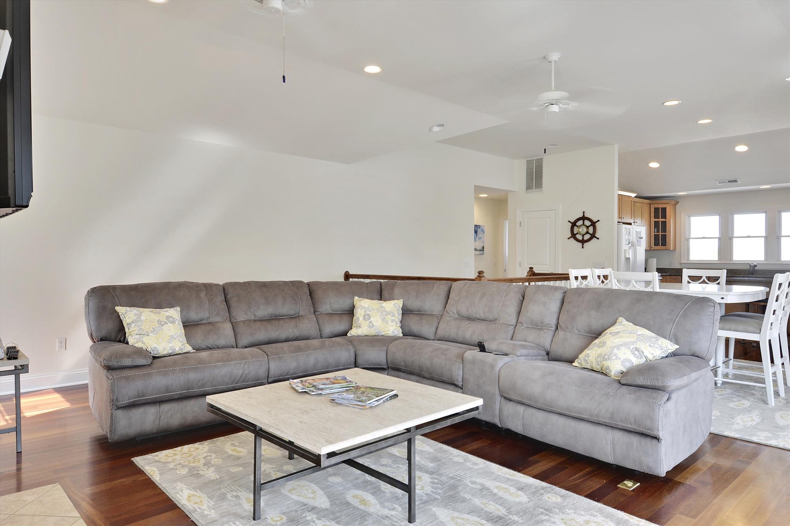 Sink into this spacious sectional sofa where you can unwind with your favorite show on the wall-mounted TV and enjoy the open-concept flow.
