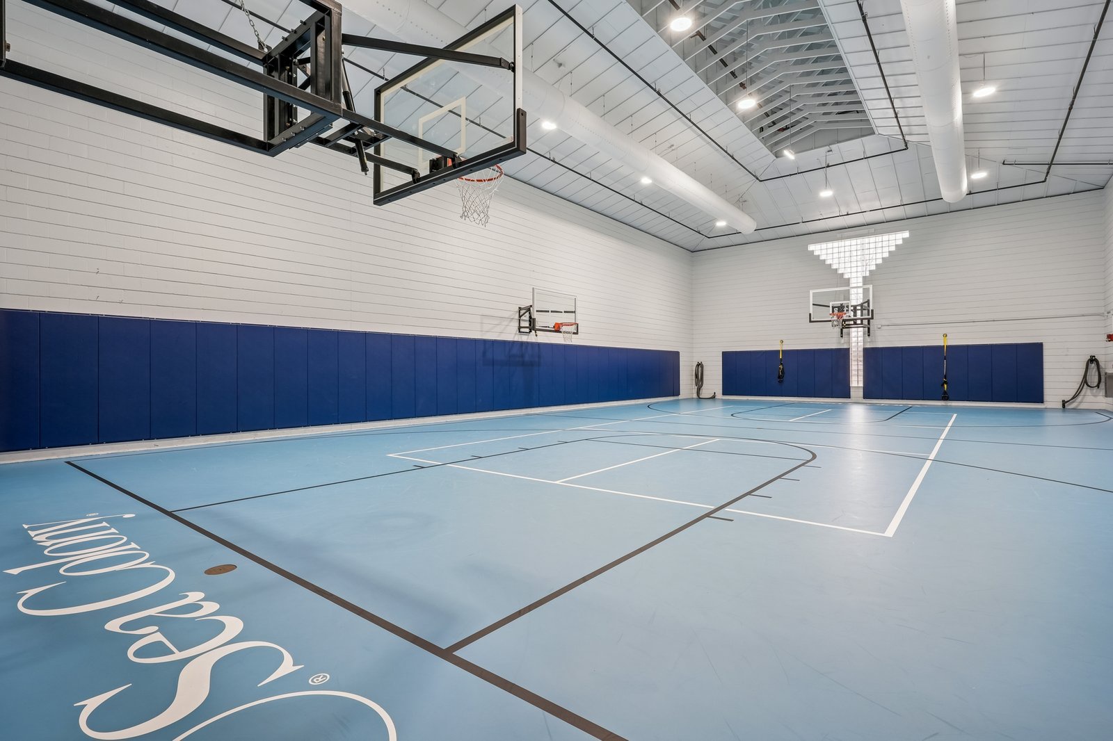 Challenge friends to a game in this full-size basketball court with professional hoops and plenty of space to play.