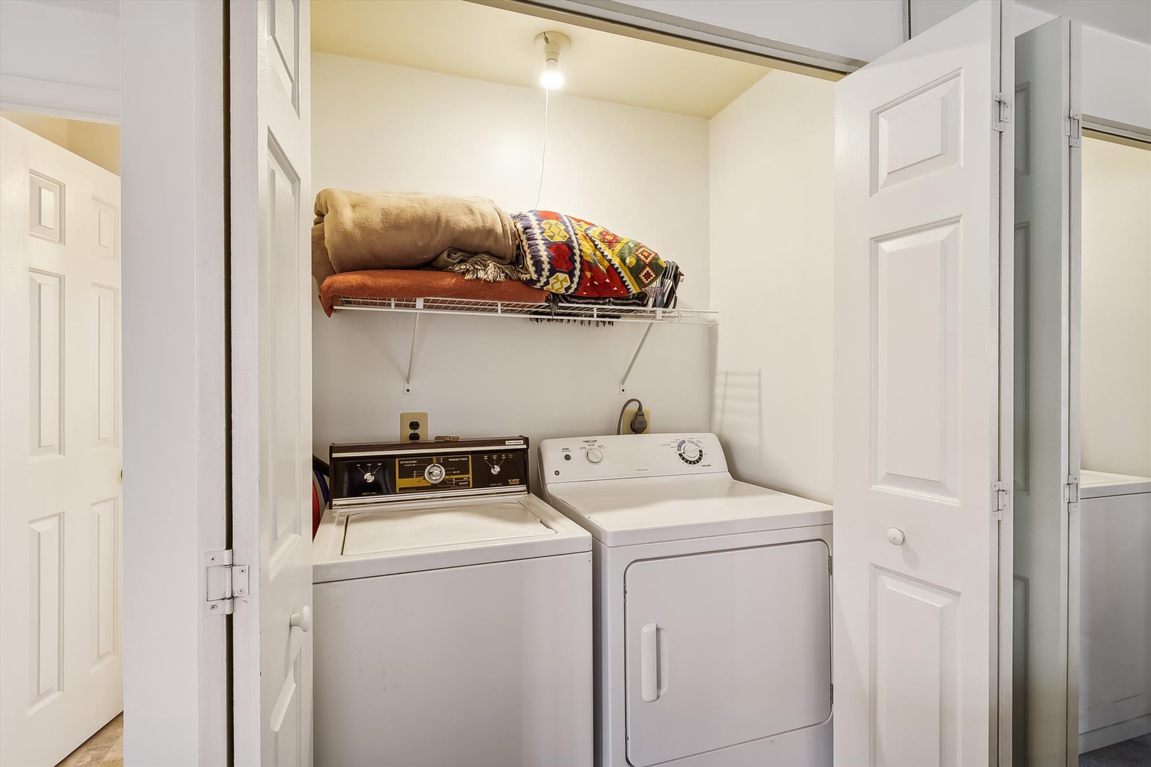 Your personal laundry area makes extended stays effortless, with a full washer and dryer tucked conveniently into your space—plus storage above for extra linens and towels.