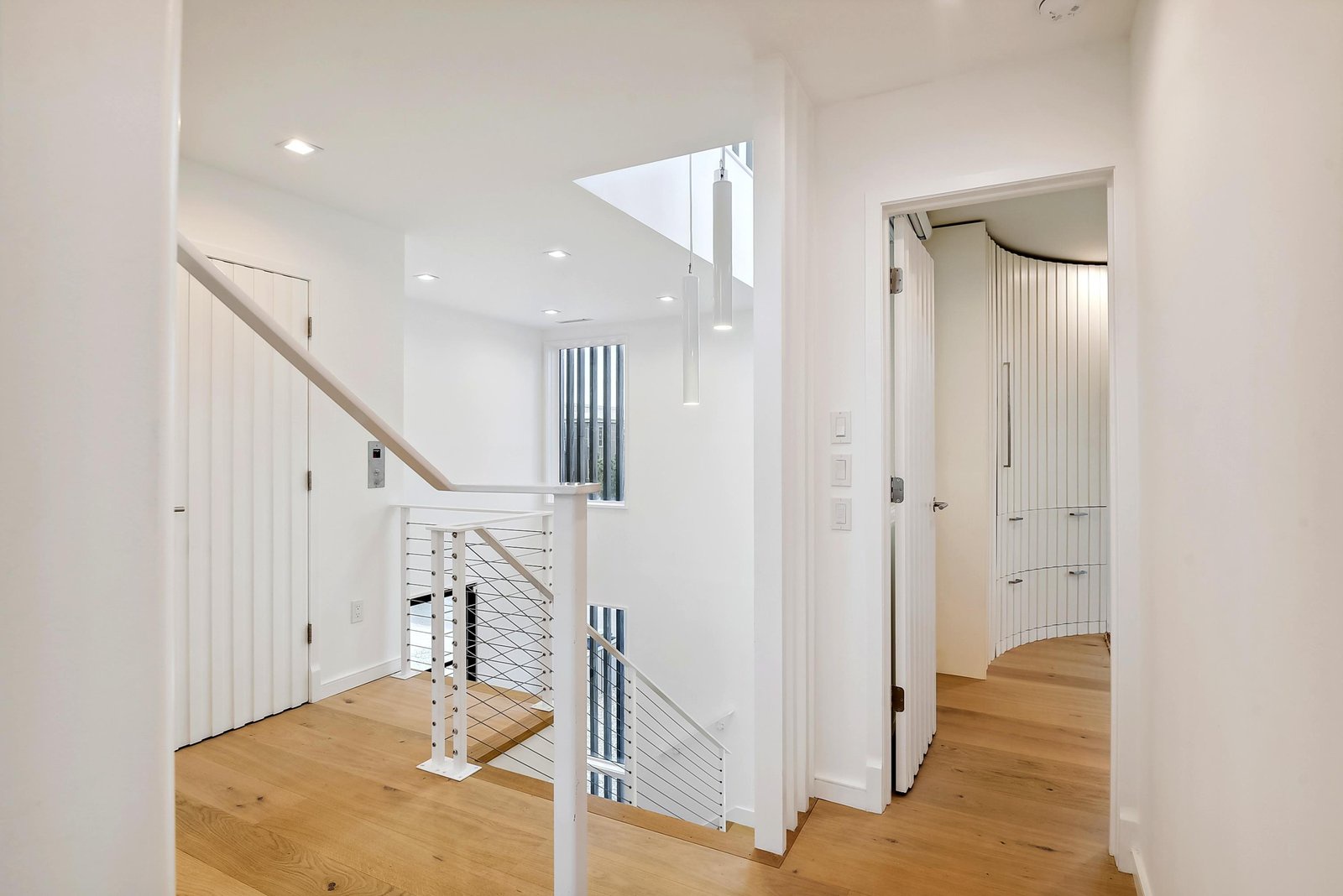 Step into your light-filled retreat, where soaring ceilings and natural wood floors create a sense of openness and warmth. The skylight bathes the space in gentle daylight, making you feel instantly at home.