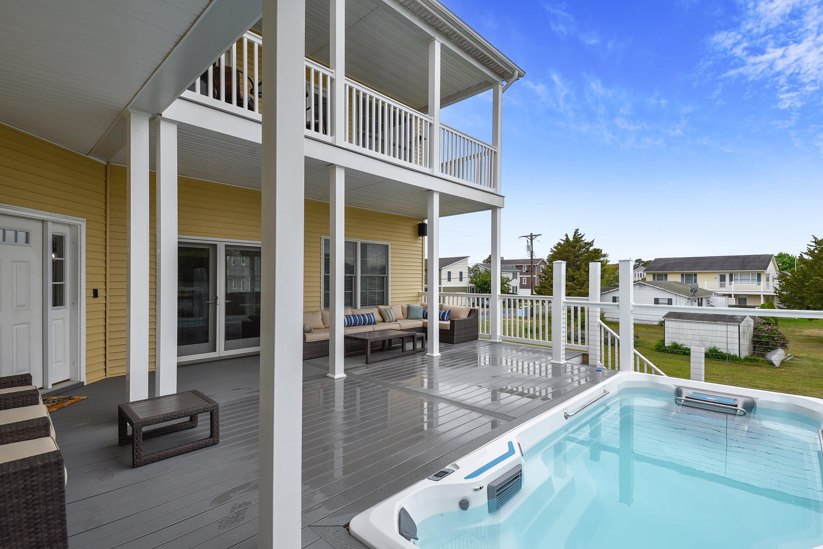 Step onto your expansive private deck and sink into the hot tub, surrounded by open skies and coastal breezes—the perfect spot to relax after a day at the beach.
