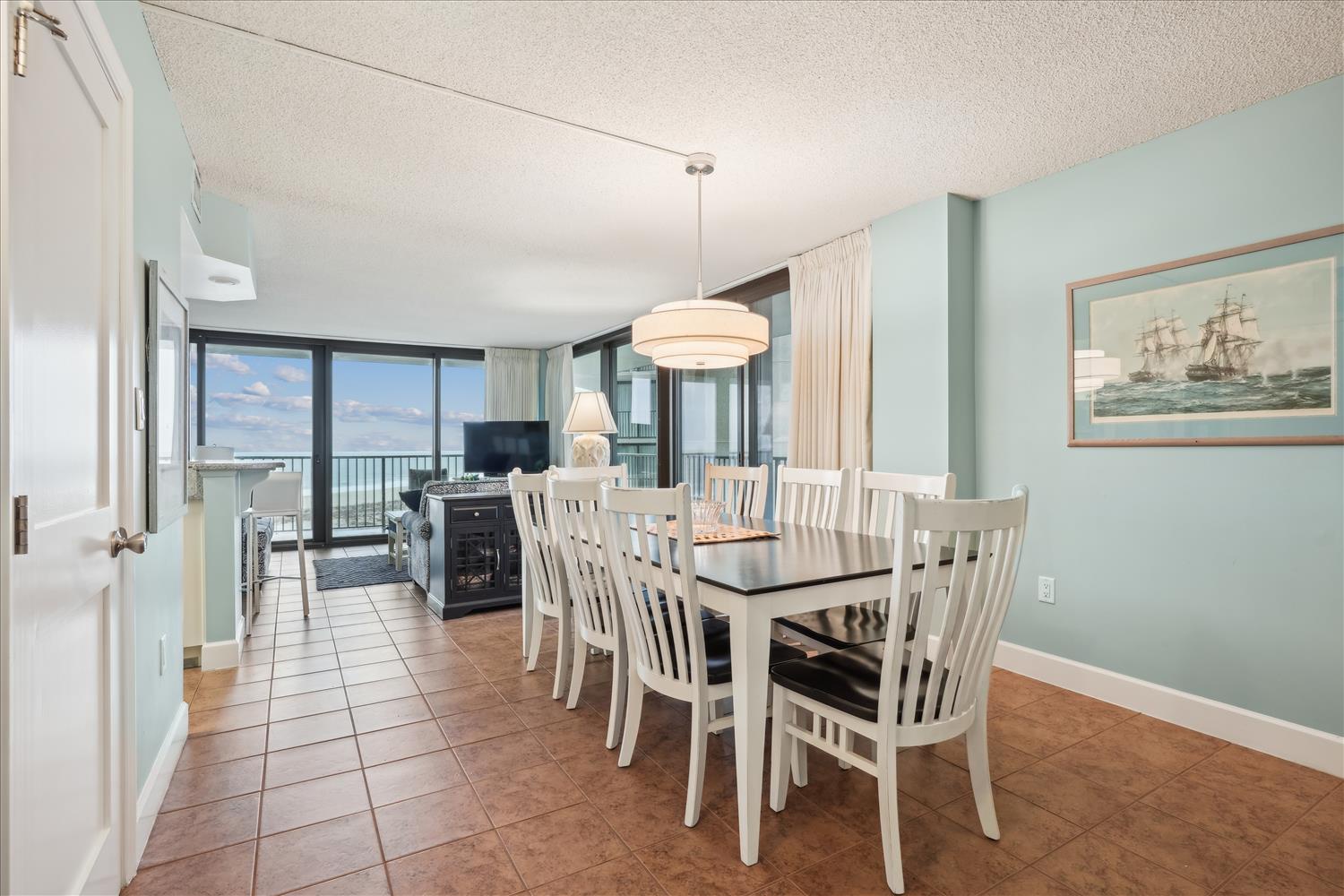 Gather around the table for meals with ocean breezes just beyond your private balcony. Soothing coastal colors, a cozy fireplace, and plenty of space make this your perfect seaside retreat.