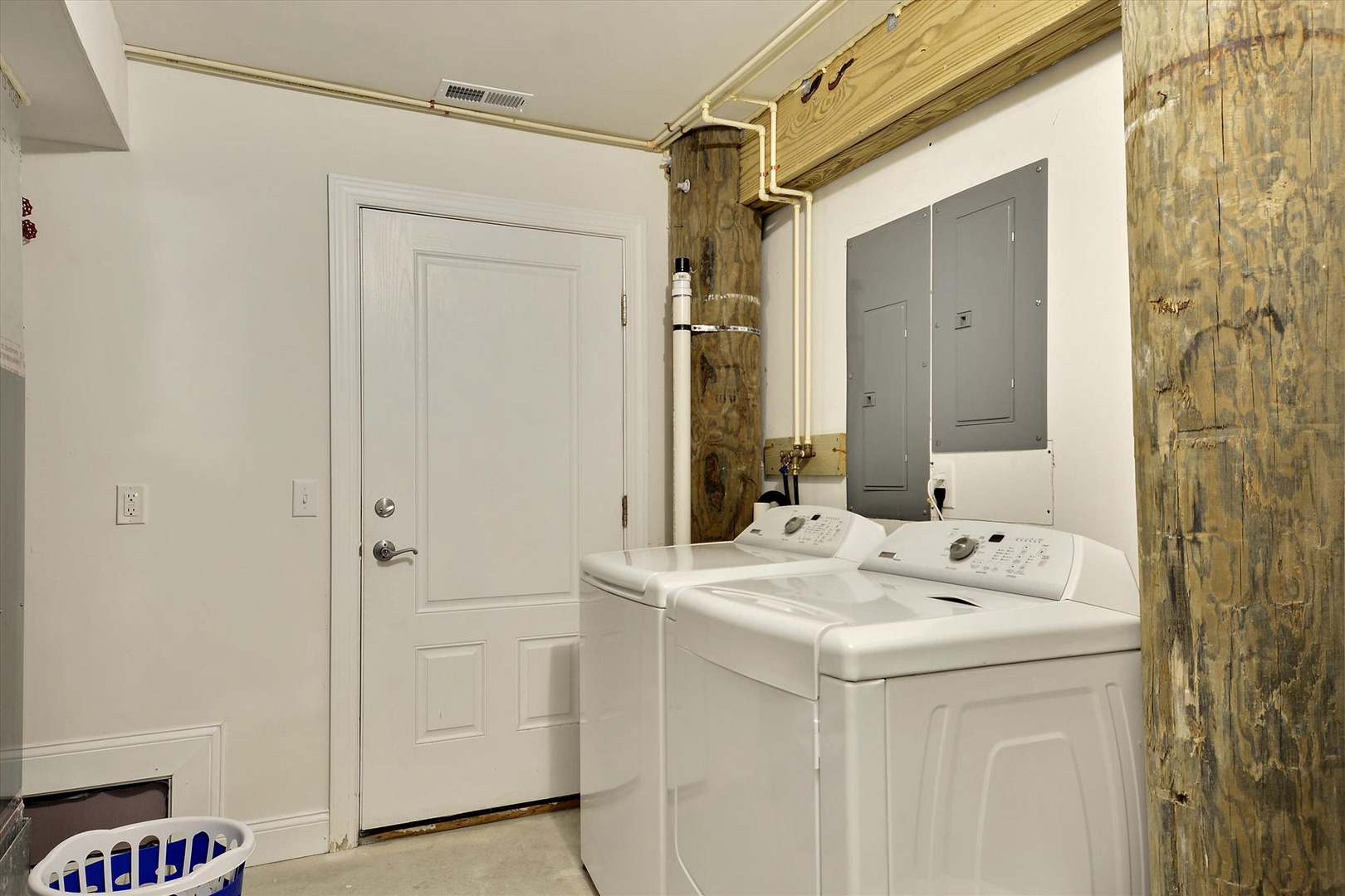 Your convenience is covered with an in-unit washer and dryer, tucked into a charming laundry nook with rustic wooden beam accents for effortless upkeep during your stay.