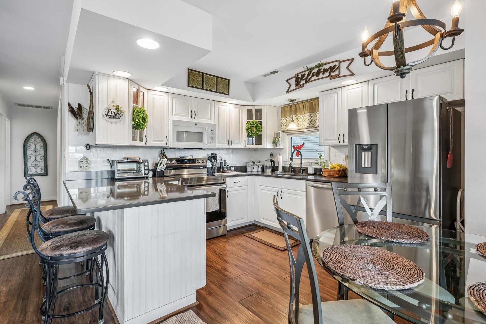 Picture yourself preparing your favorite meals in this bright, fully equipped kitchen with modern appliances, stylish seating, and all the comforts of home.