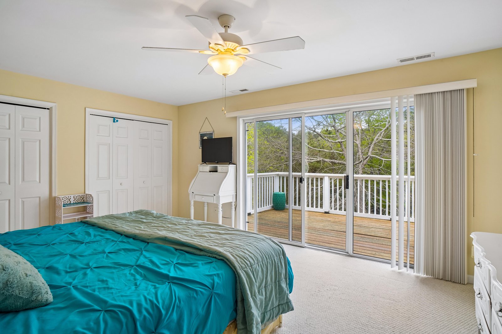 Drift off in this bright bedroom with sliding doors opening to your private balcony. Wake to treetop views and enjoy the gentle breeze as sunlight fills your peaceful retreat.