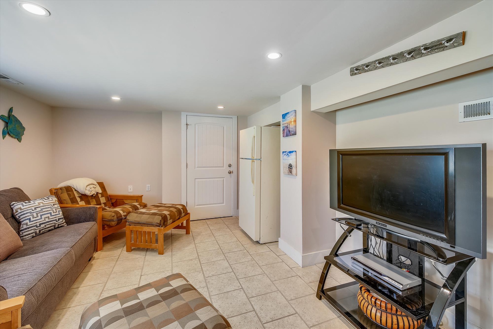 Unwind in your own cozy living space with comfortable seating, entertainment, and a full-size fridge to store your favorite snacks and drinks during your stay.