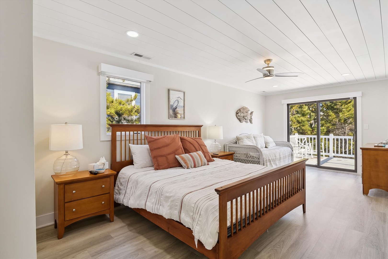 Sink into comfort in your serene bedroom, where coastal charm meets modern ease. Step onto your private balcony to feel the fresh air and soak in peaceful outdoor views.
