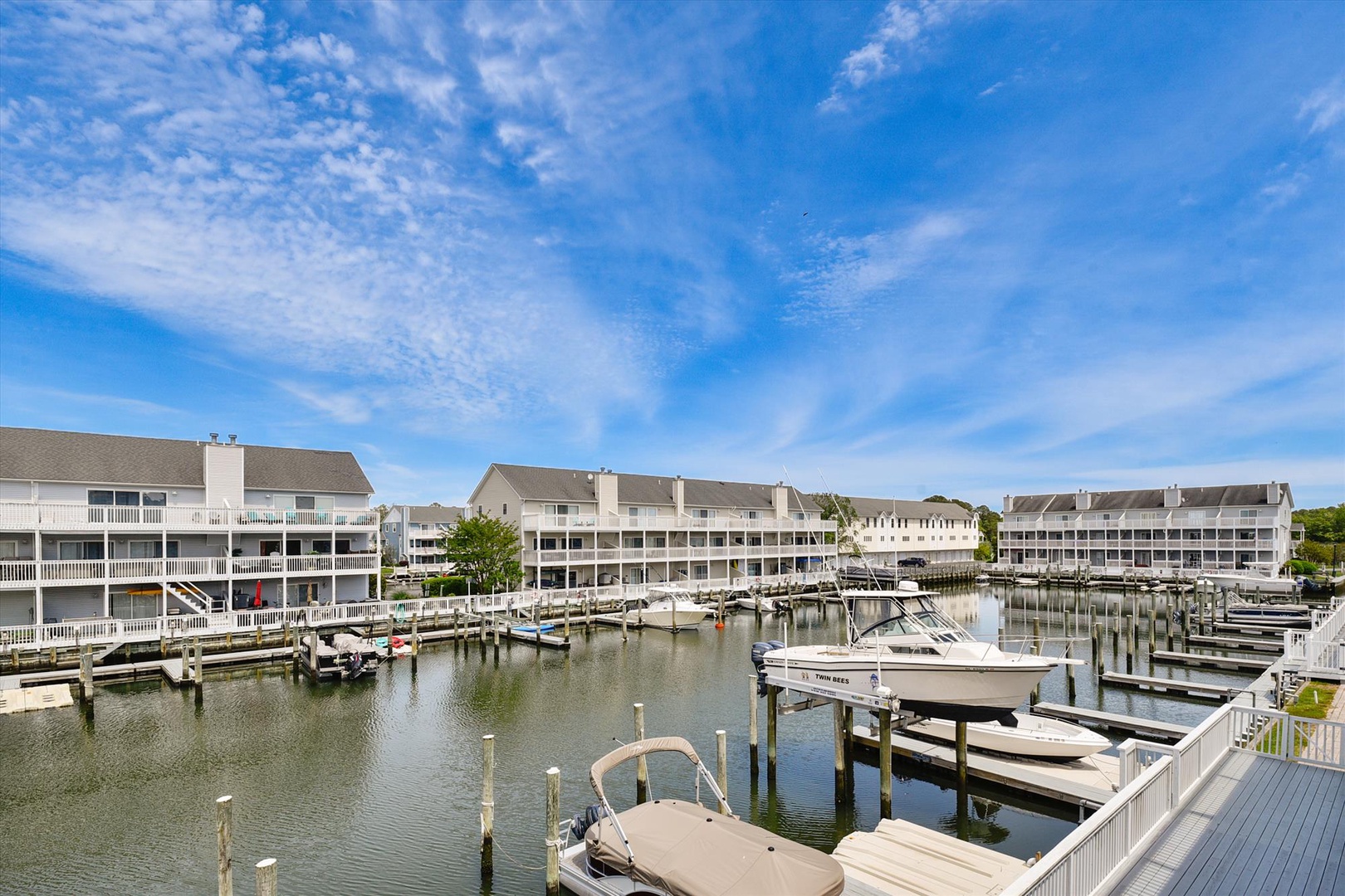 This waterfront vacation rental community features private boat slips at your doorstep, perfect for exploring the peaceful marina and surrounding waterways during your coastal escape.
