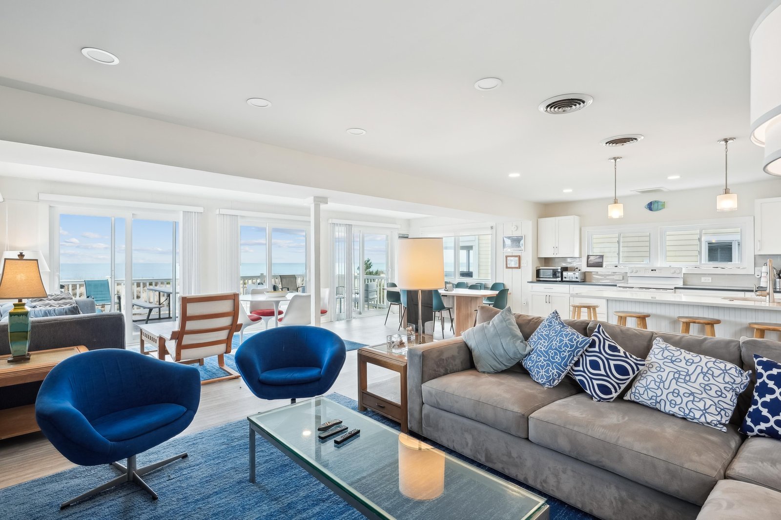 Unwind in your spacious living room, where ocean breezes drift through open balcony doors and plush seating invites you to settle in and soak up stunning sea views.