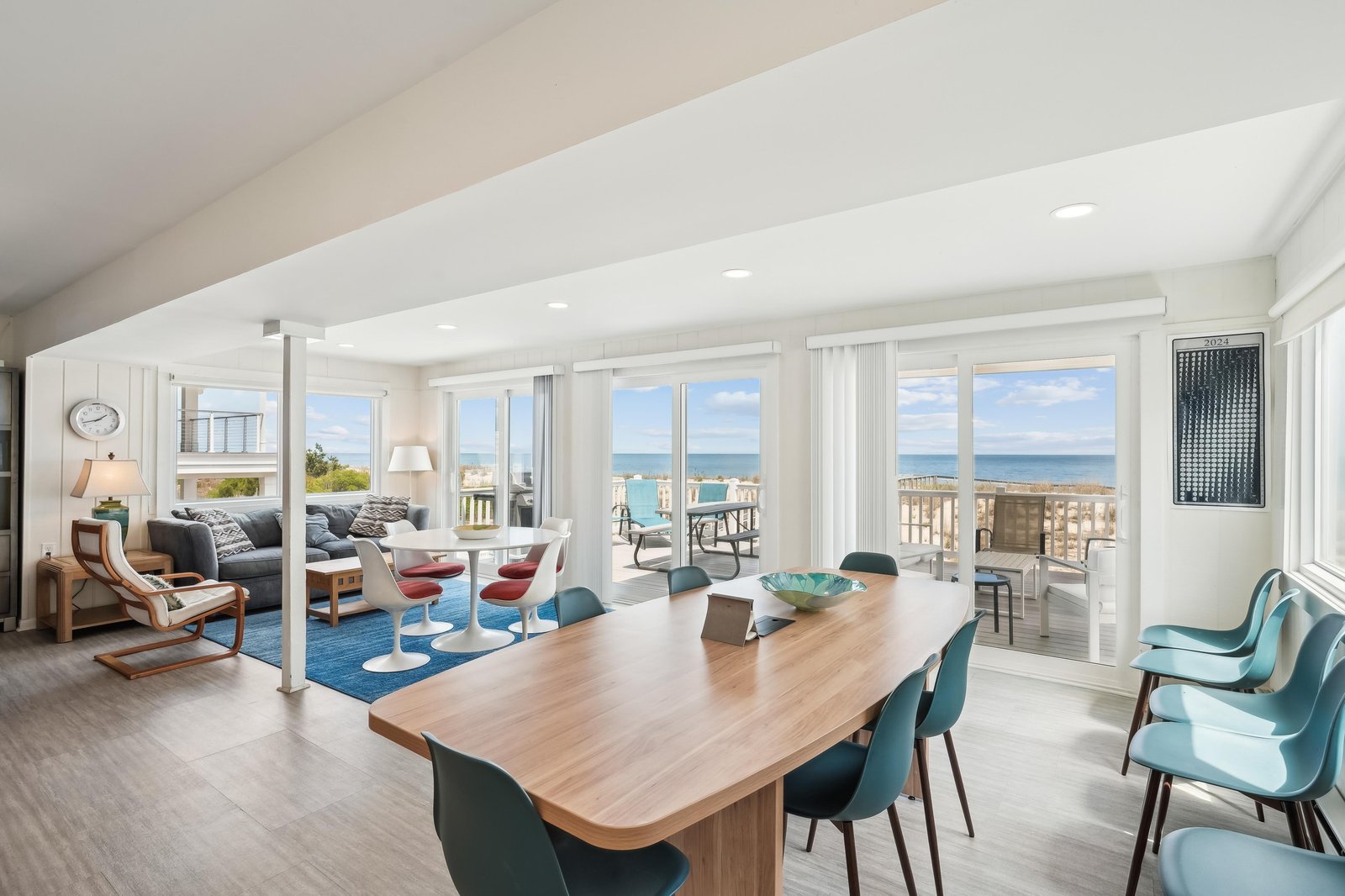 Sink into modern coastal comfort as you take in sweeping ocean views from nearly every corner. This bright, open-plan space flows effortlessly from dining to living, inviting you to unwind or gather with loved ones just steps from your private deck.