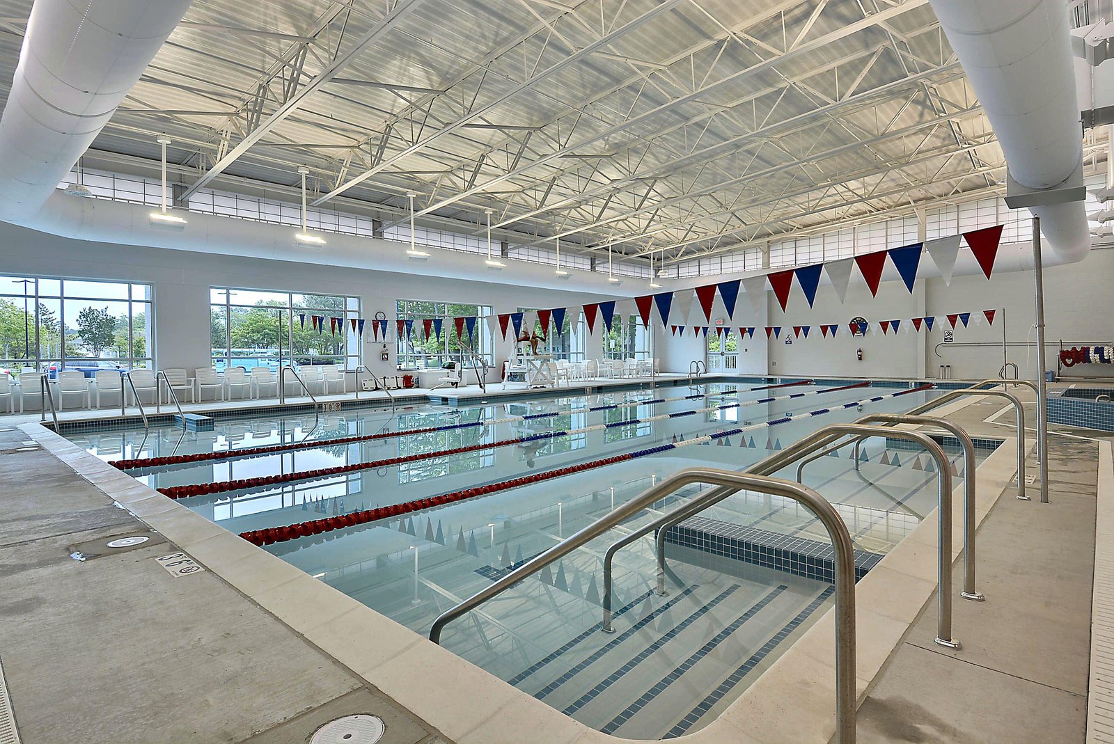 A bright, spacious indoor pool with competition lanes invites you to enjoy invigorating laps or leisurely swims beneath a high, naturally lit ceiling.