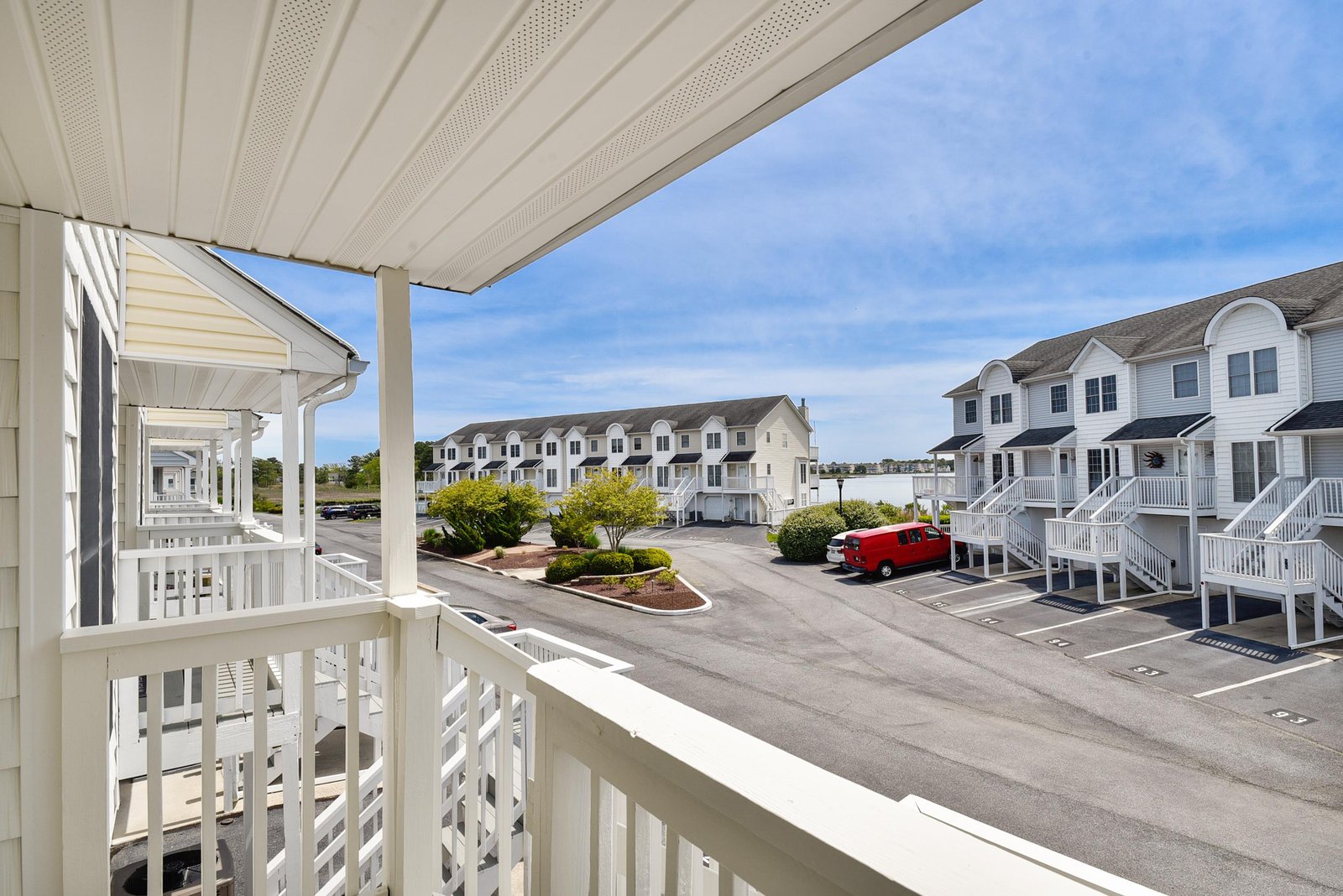 The balcony overlooks a well-maintained residential neighborhood with convenient parking just steps away and easy access to all the area has to offer.