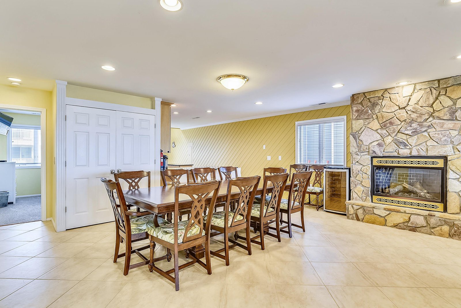 Gather around the large dining table for memorable meals with your group, warmed by the stone fireplace that anchors this inviting space.