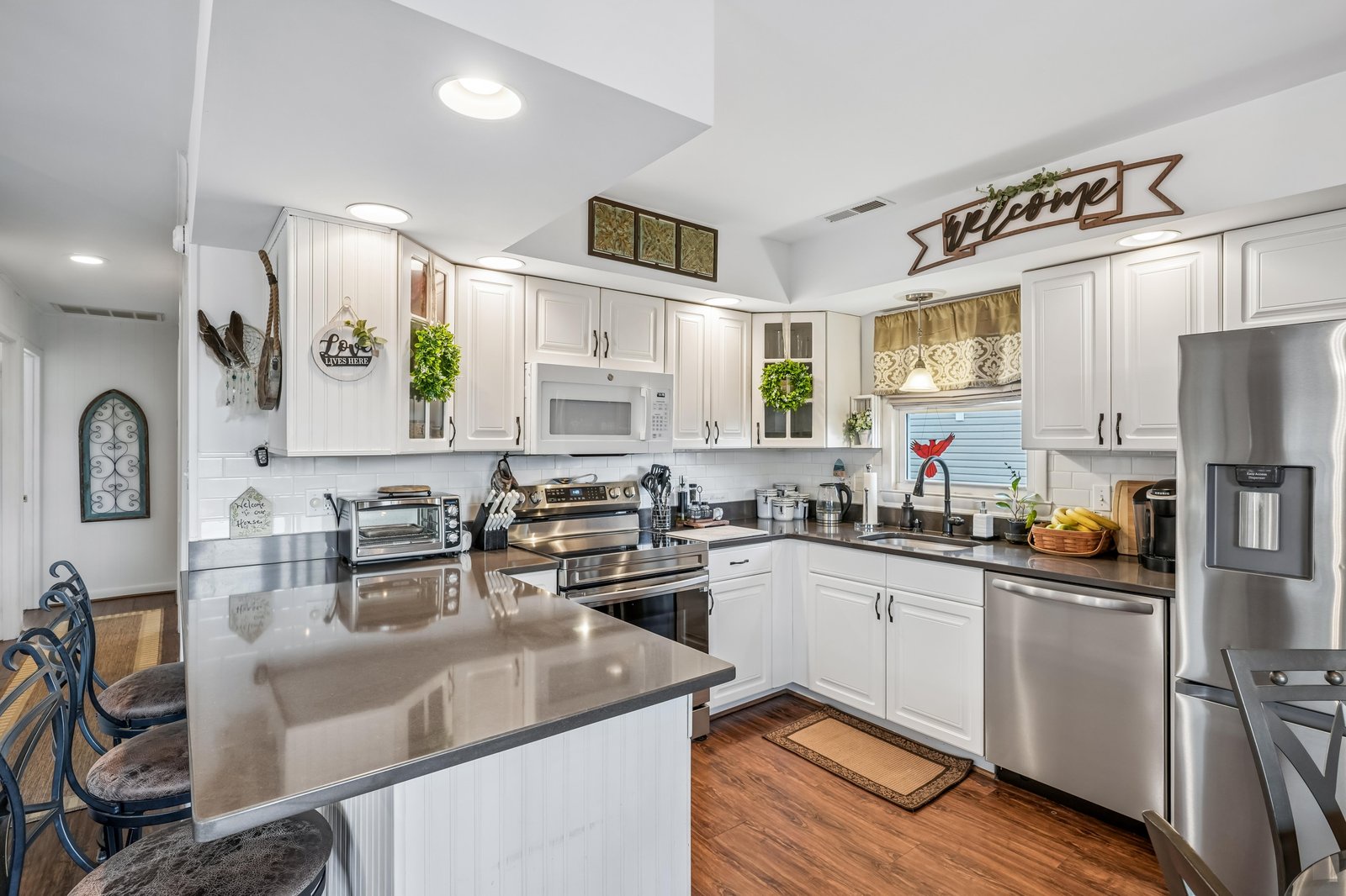 Step into your spacious, fully-equipped kitchen with gleaming countertops, modern appliances, and all the charm of home—perfect for whipping up a vacation feast or sipping morning coffee at the cozy island.