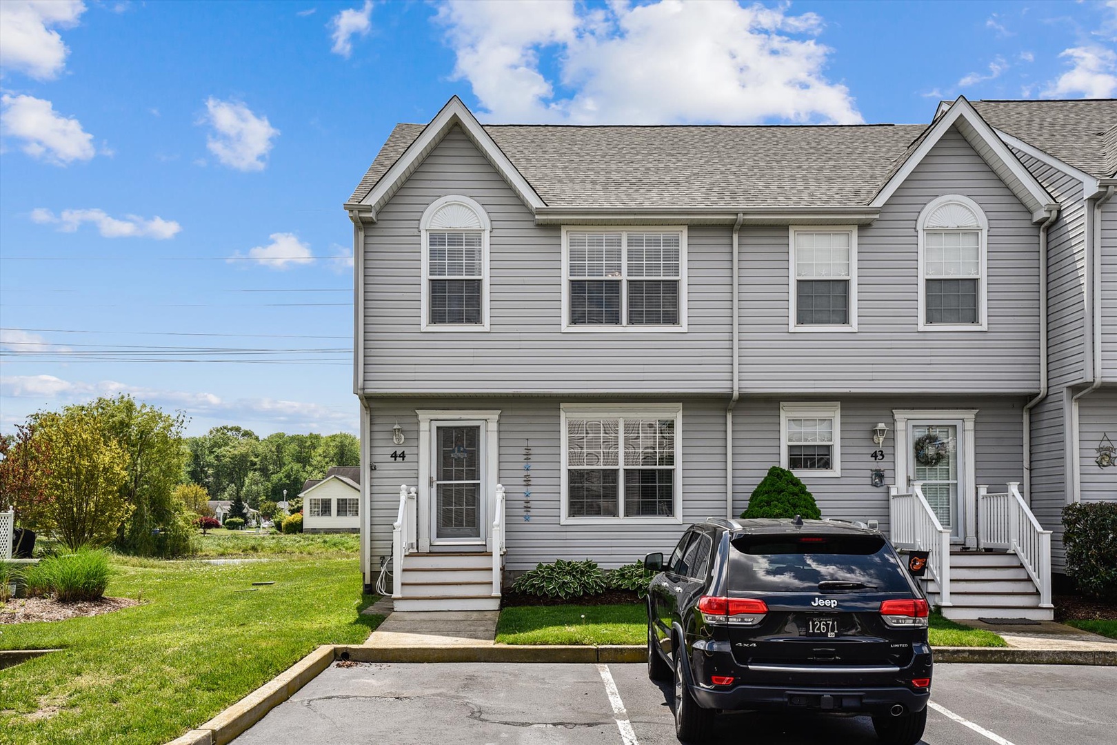 Modern two-story rental townhome with dedicated parking in a quiet residential neighborhood, offering easy access to nearby attractions and local amenities.