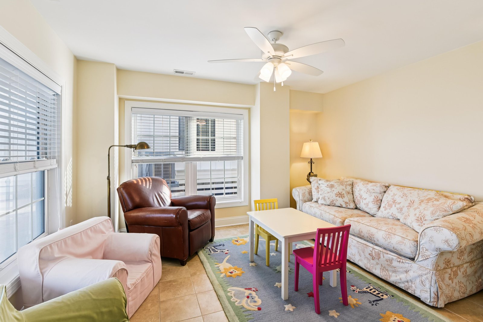 Settle into your cozy living space with plush seating and a kid-friendly play area—perfect for unwinding together after a day of exploring.
