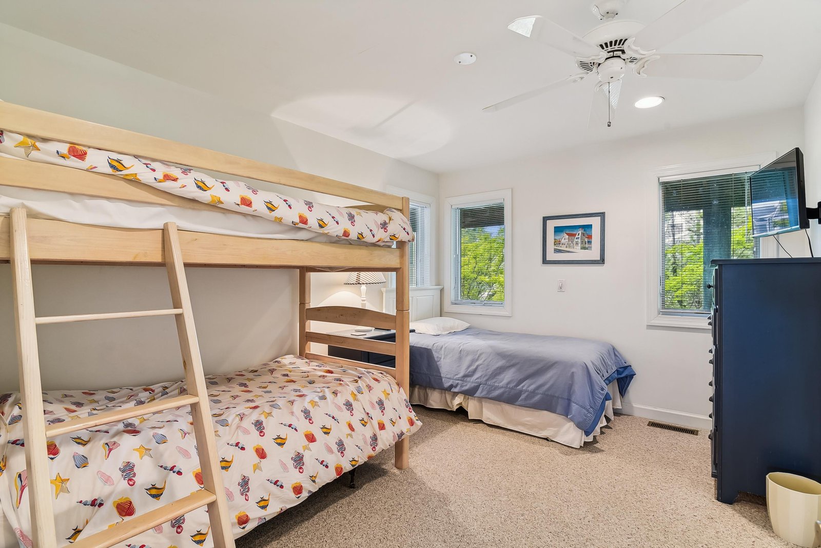Bright and cheerful space for the little ones with a fun bunk bed and extra sleeping area—your kids will love having their own cozy corner while you relax nearby.