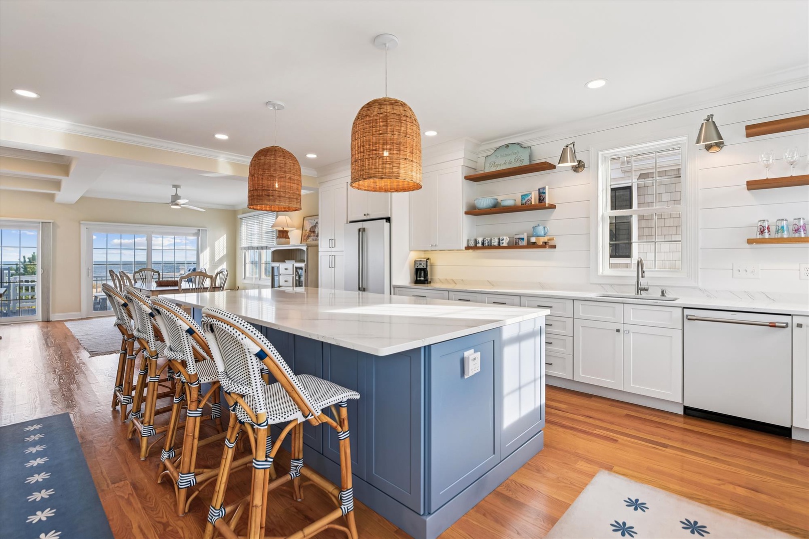 Step into your gourmet coastal kitchen, where ocean breezes meet modern comfort. Gather around the spacious island, perfect for morning coffee or evening cocktails with loved ones.