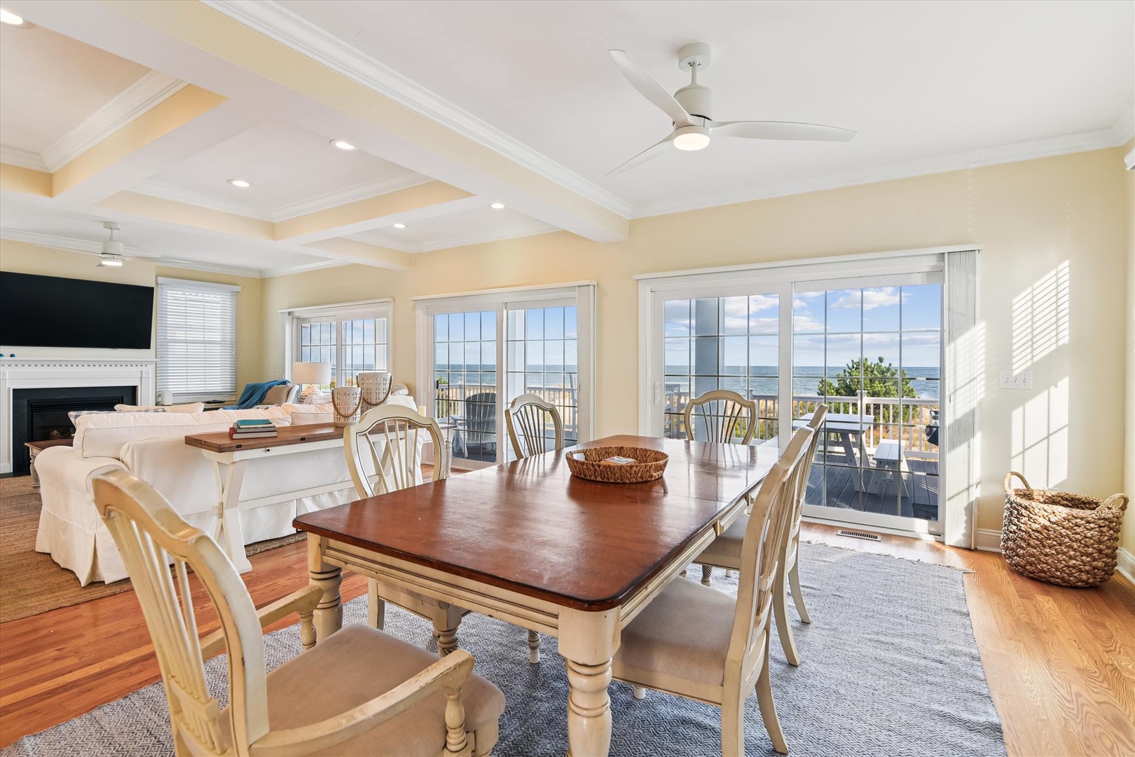 Gather around the cozy dining table where sunlit windows frame stunning water views, then step onto your private balcony to soak in the coastal breeze and serene scenery.