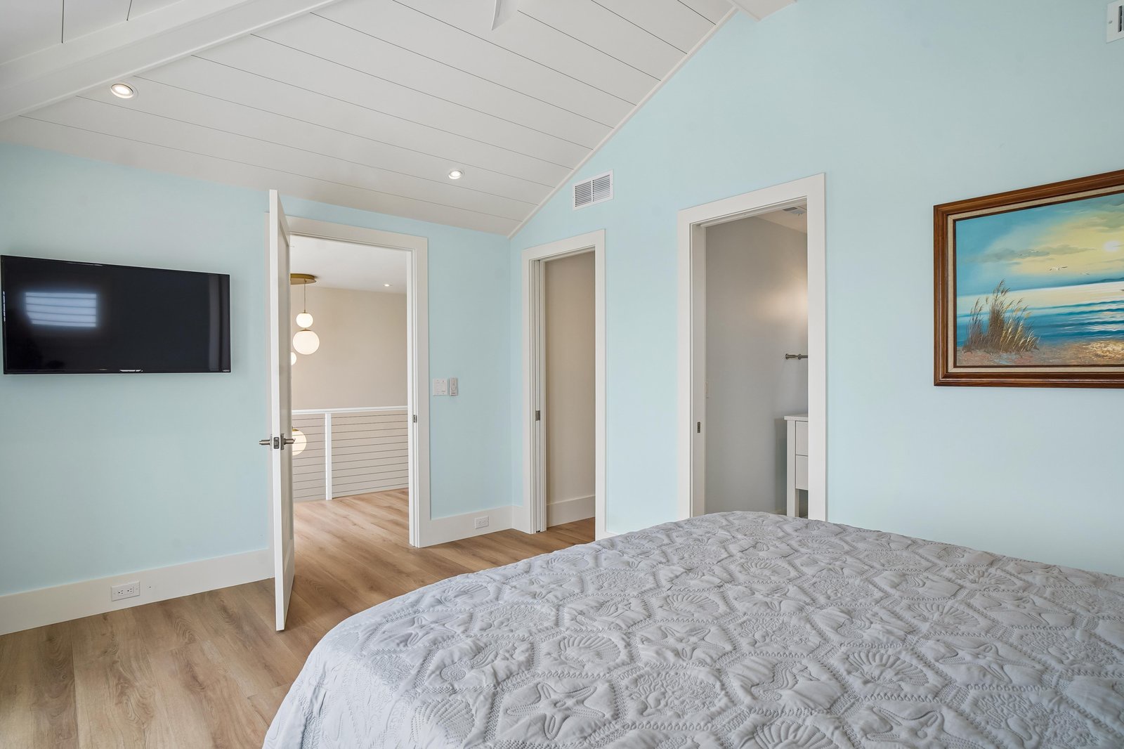 Drift off surrounded by soothing coastal hues and vaulted ceilings that create an airy, restful retreat for your seaside escape.