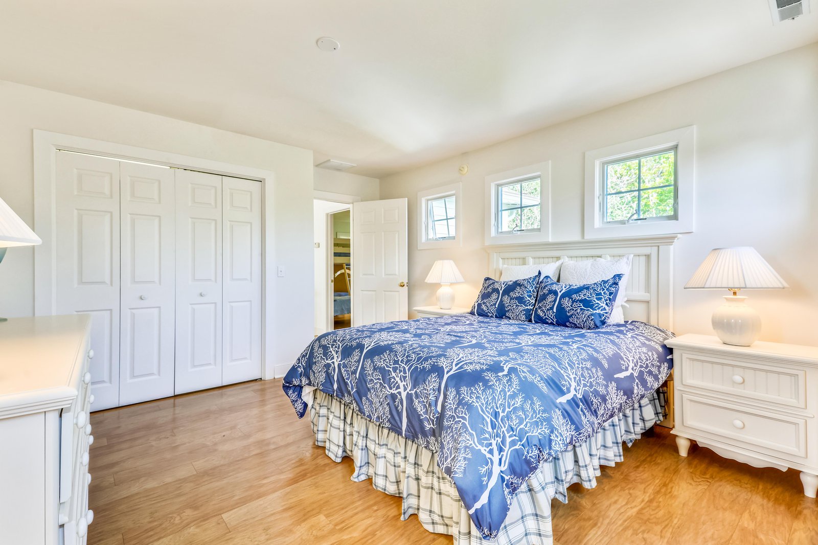 Rest easy in your private sanctuary, where soft natural light streams through charming windows and elegant bedding invites peaceful slumber after your day's adventures.