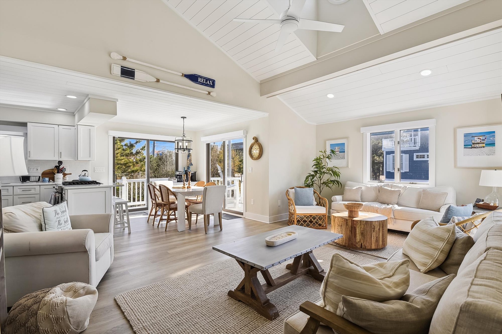 Settle into this bright open-concept space where coastal charm meets comfort. You'll love gathering in the airy living area or sharing meals by windows that frame serene outdoor views.
