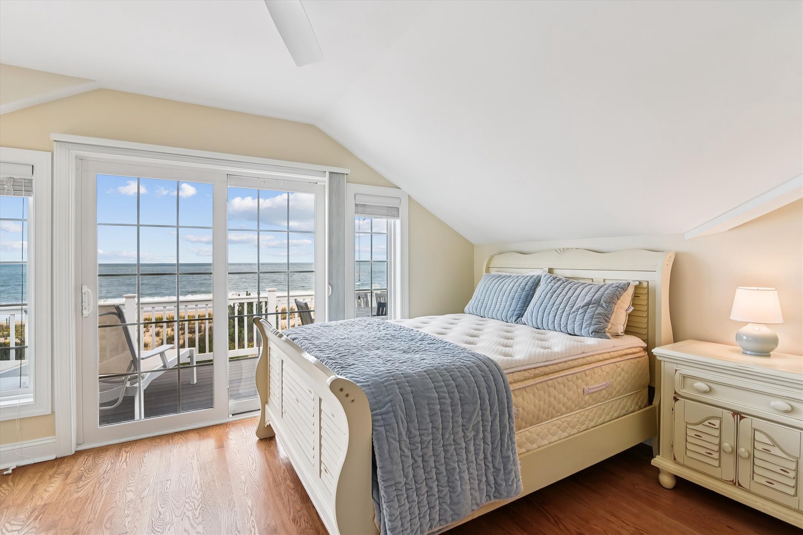 Wake up to breathtaking ocean views from your cozy bedroom, where soft coastal breezes and the sound of waves greet you each morning through the private balcony doors.