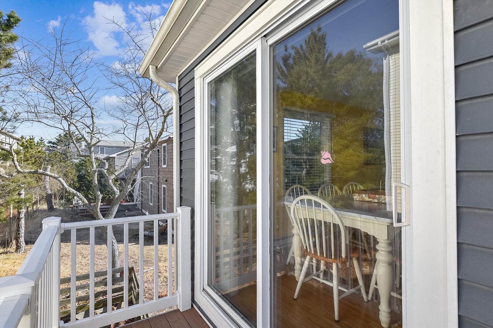 Step onto your private balcony and soak in the peaceful neighborhood views, framed by tall trees and open sky—a lovely spot for morning coffee or unwinding after a day of exploring.