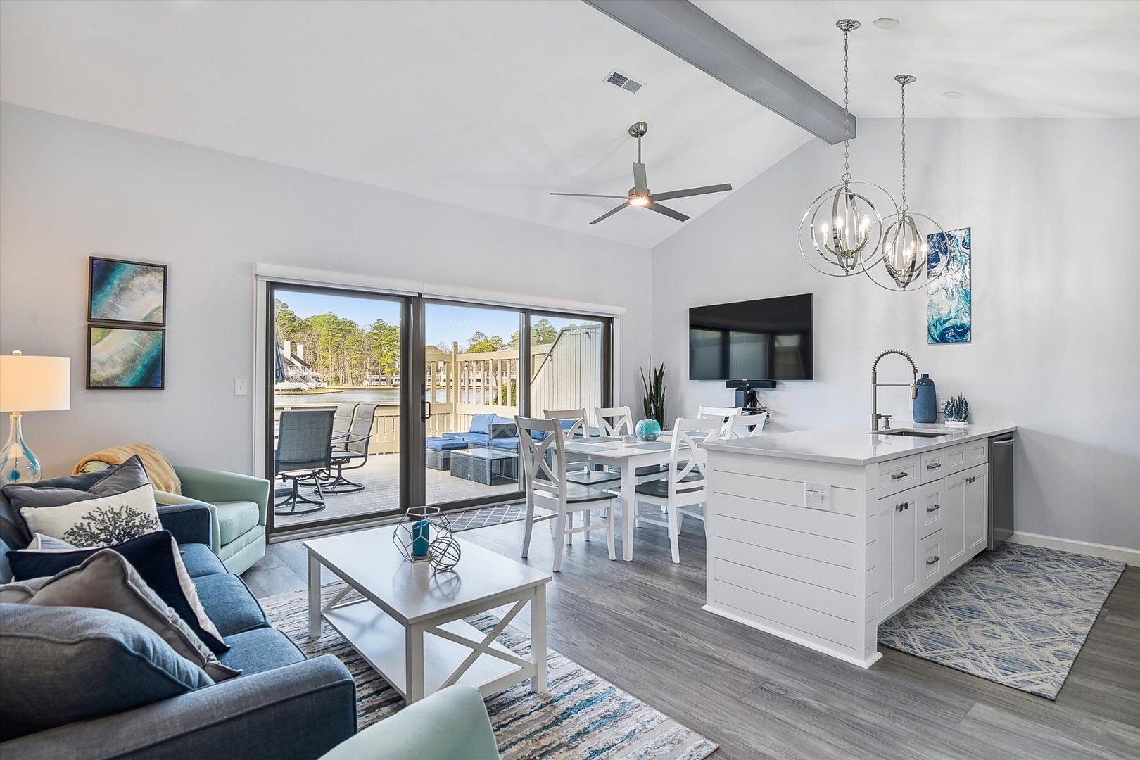 Sink into plush seating in this open-concept retreat, where coastal elegance meets modern comfort. Your living, dining, and kitchen spaces flow seamlessly together, complete with a private patio view for morning coffee or evening relaxation.