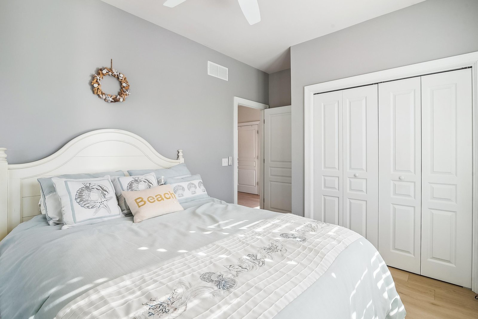 Drift off in this serene bedroom with calming coastal touches and plenty of natural light. Your stay is sure to be restful and rejuvenating.