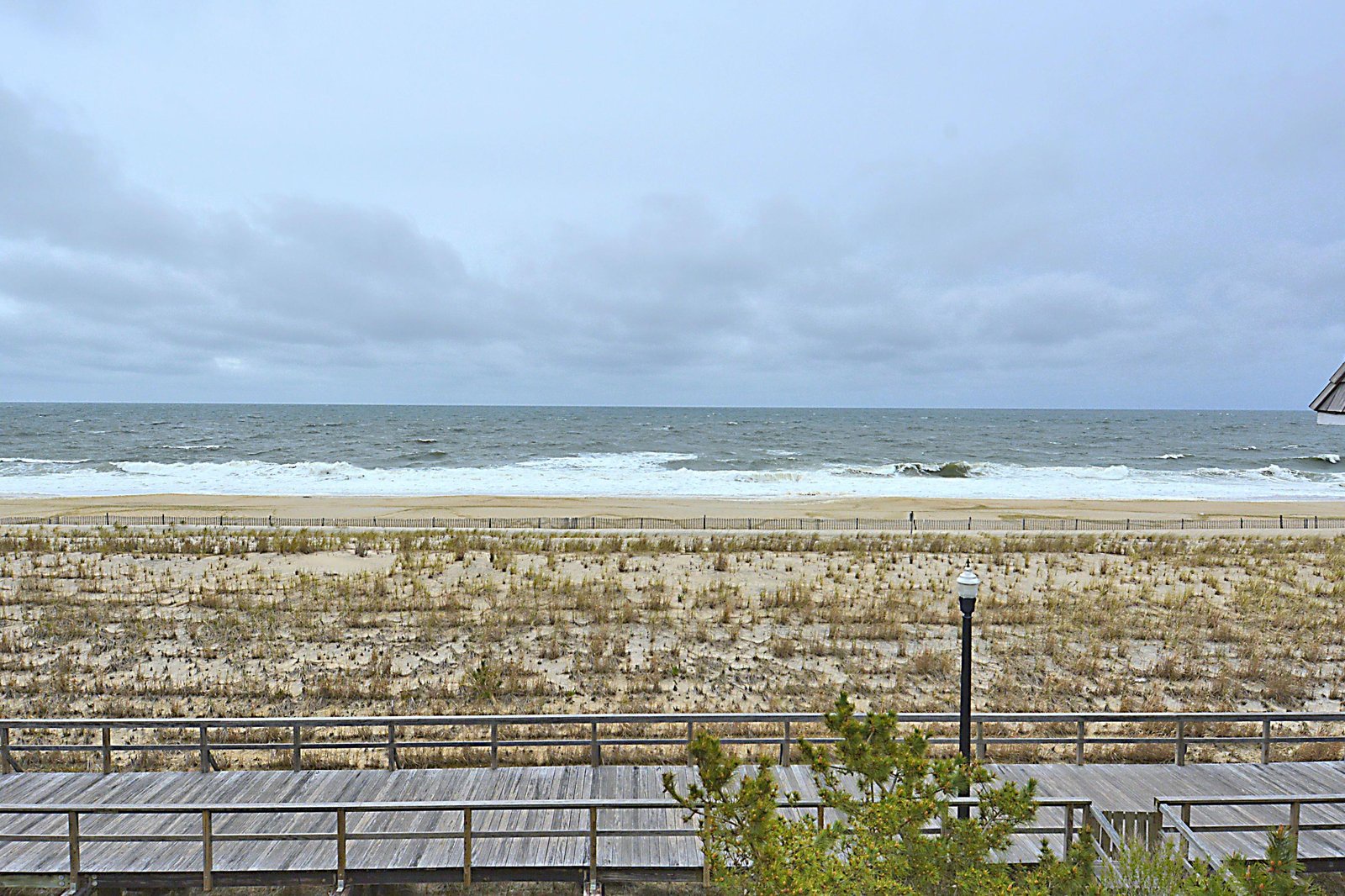 Beachfront property located steps from pristine sandy shores and rolling ocean waves, with direct access to the coastline.
