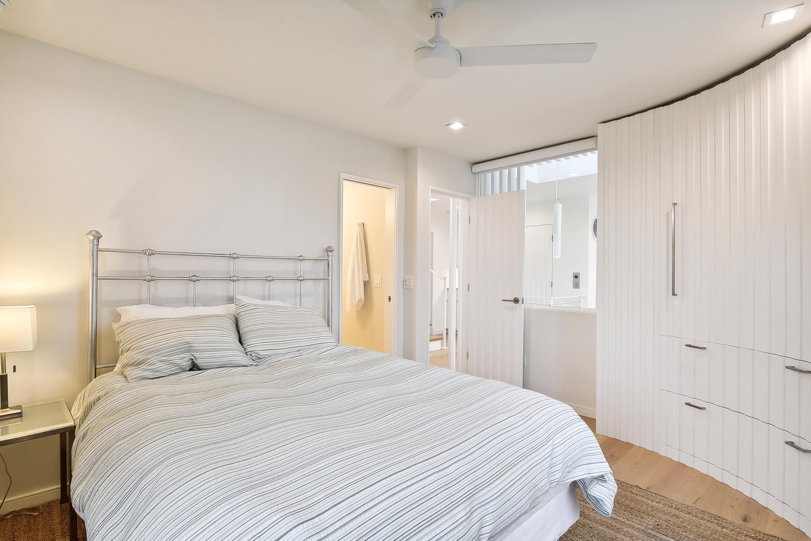 Slip into crisp, fresh linens and let the quiet calm of this peaceful bedroom wrap around you. Bright and airy, with soft lighting and plenty of storage, it's your restful retreat after a day of adventure.