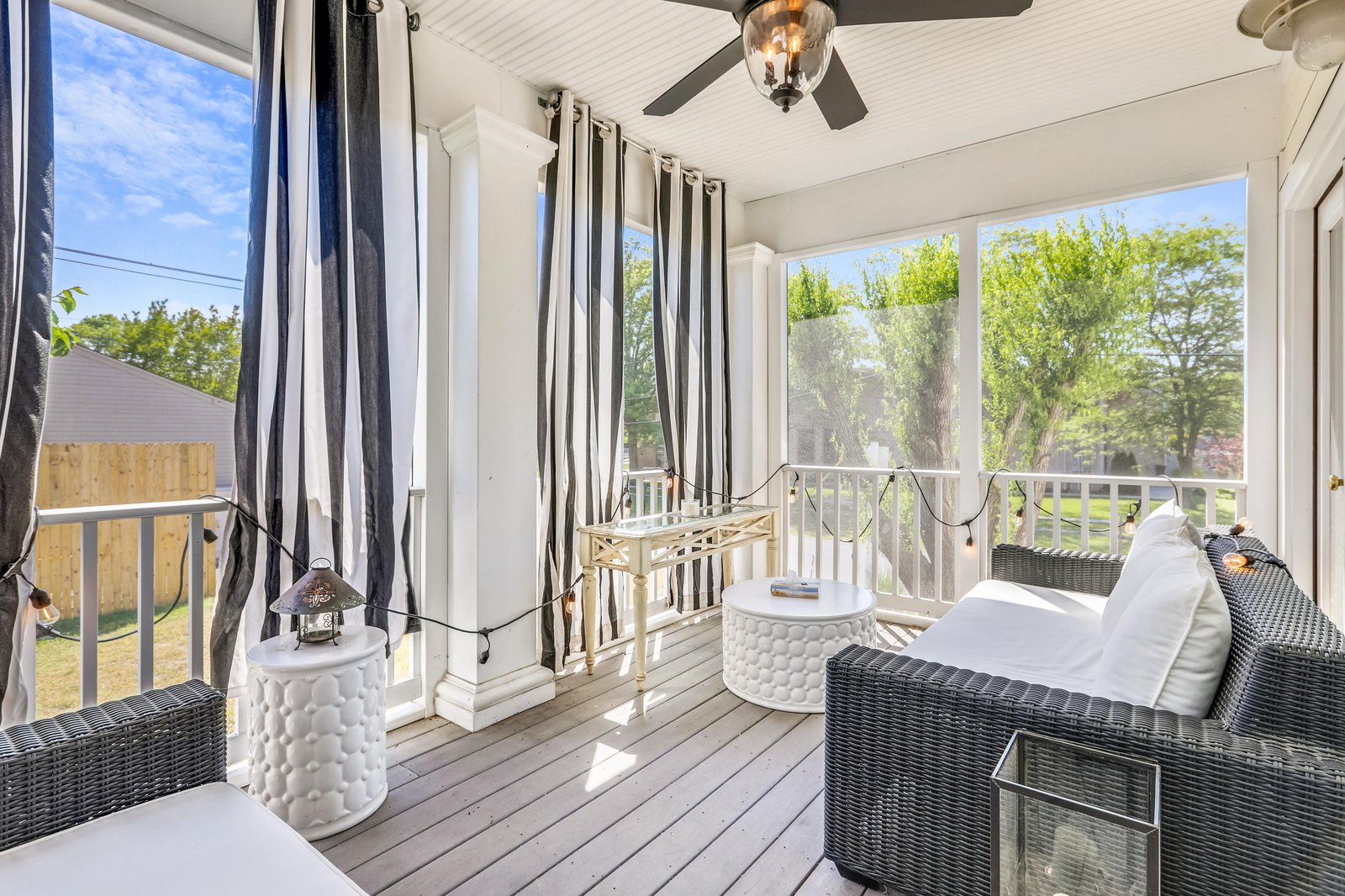 Settle into your screened-in porch with plush seating, gentle breezes, and peaceful views of the surrounding greenery—a perfect spot to unwind any time of day.