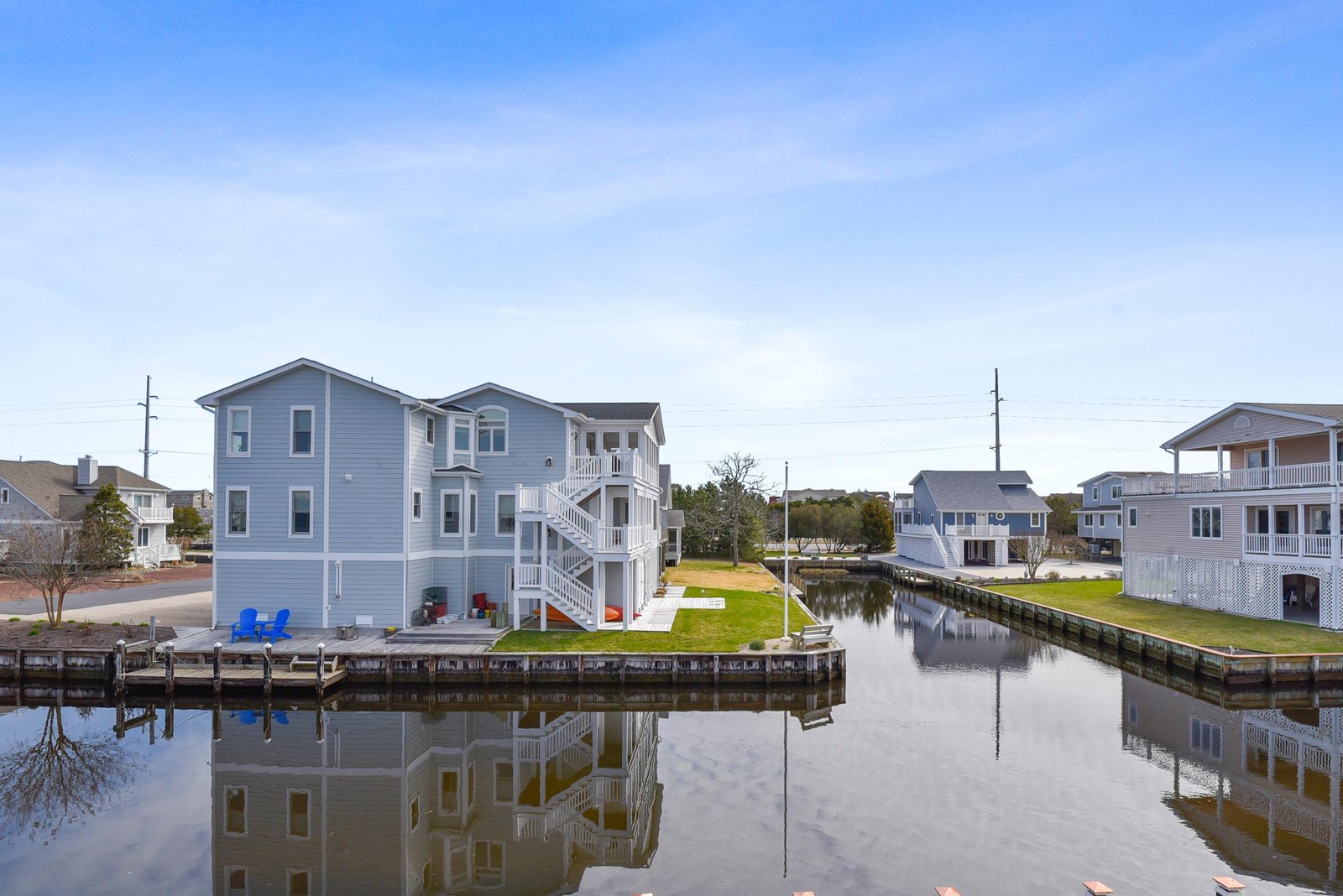 Waterfront property nestled in a peaceful canal neighborhood with private dock access and expansive views of the surrounding residential area.