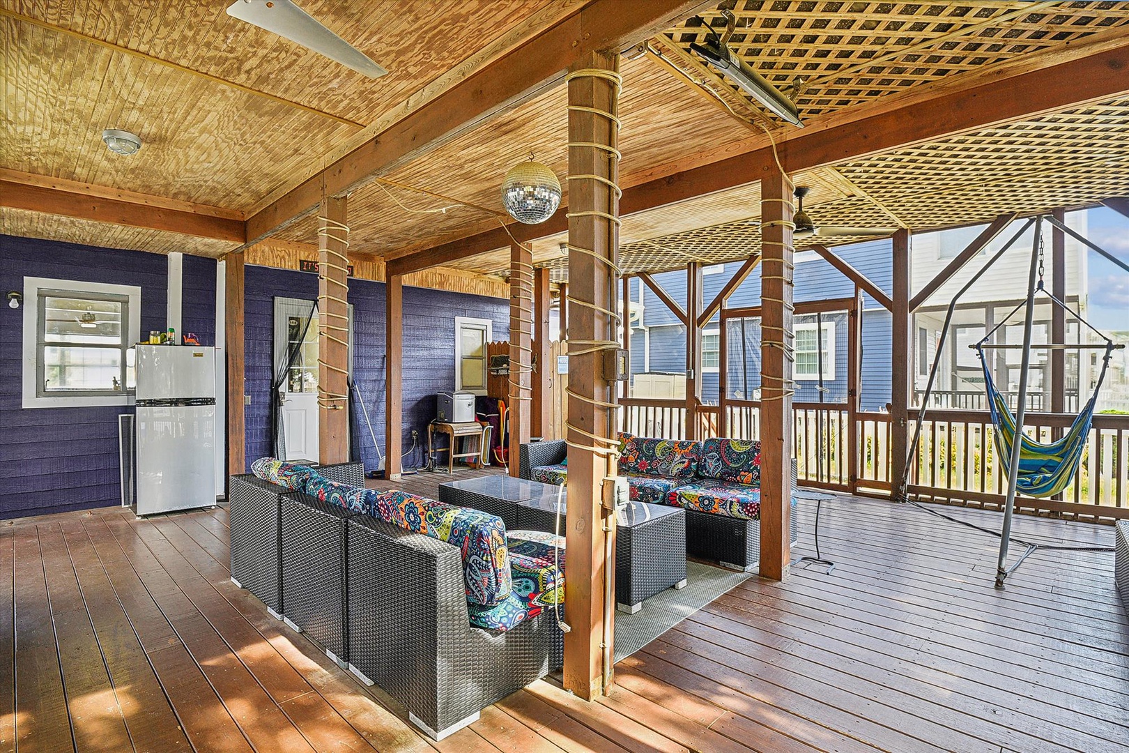 Unwind in your private covered deck, where woven wicker seating and a hammock await. The bamboo detailing and open-air design invite you to relax with refreshments from the adjacent kitchenette.