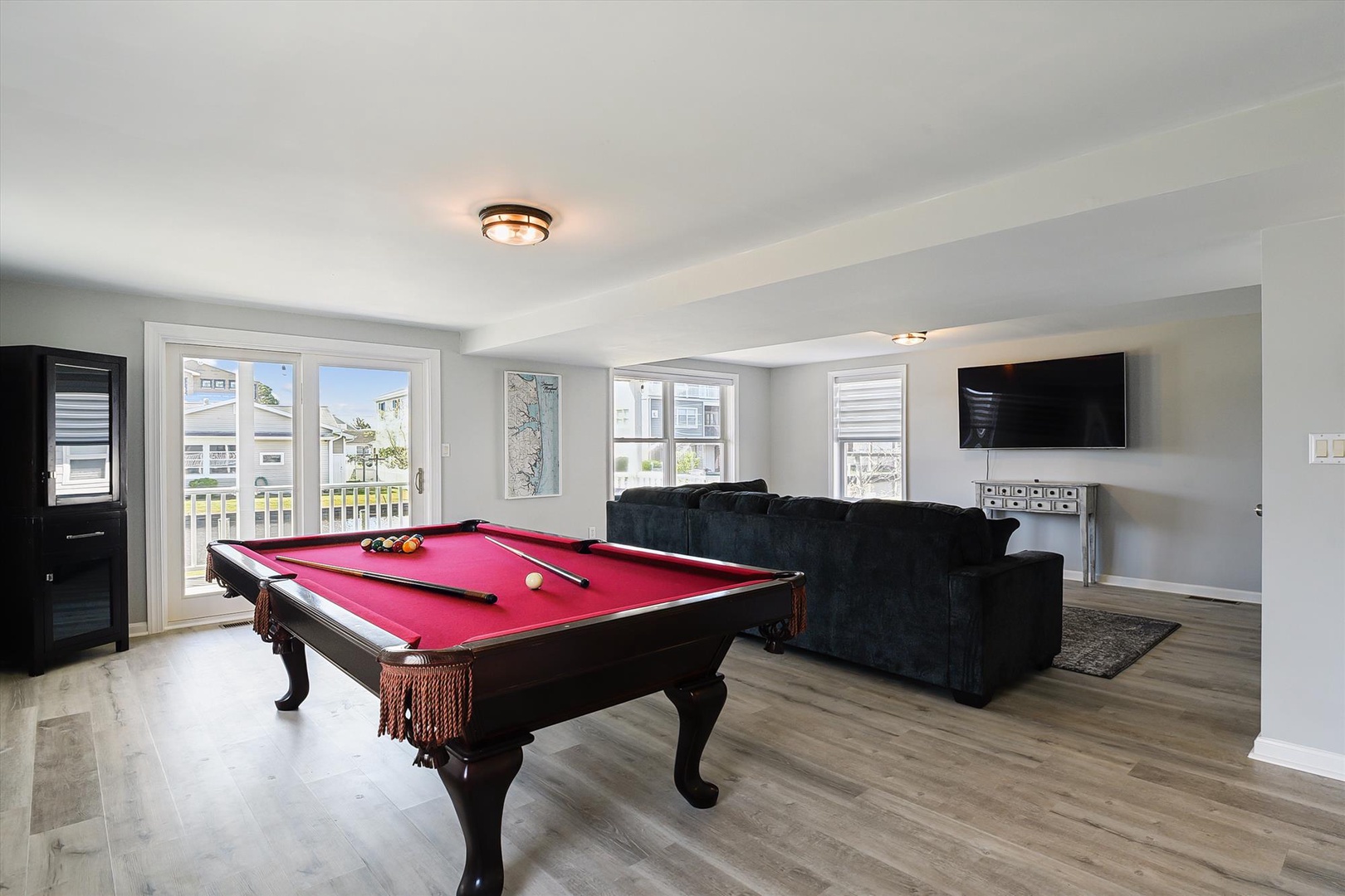 Challenge your travel companions to a game of pool in this bright, airy space. Sink into the plush sofa for movie nights, or step outside through French doors to catch the breeze.