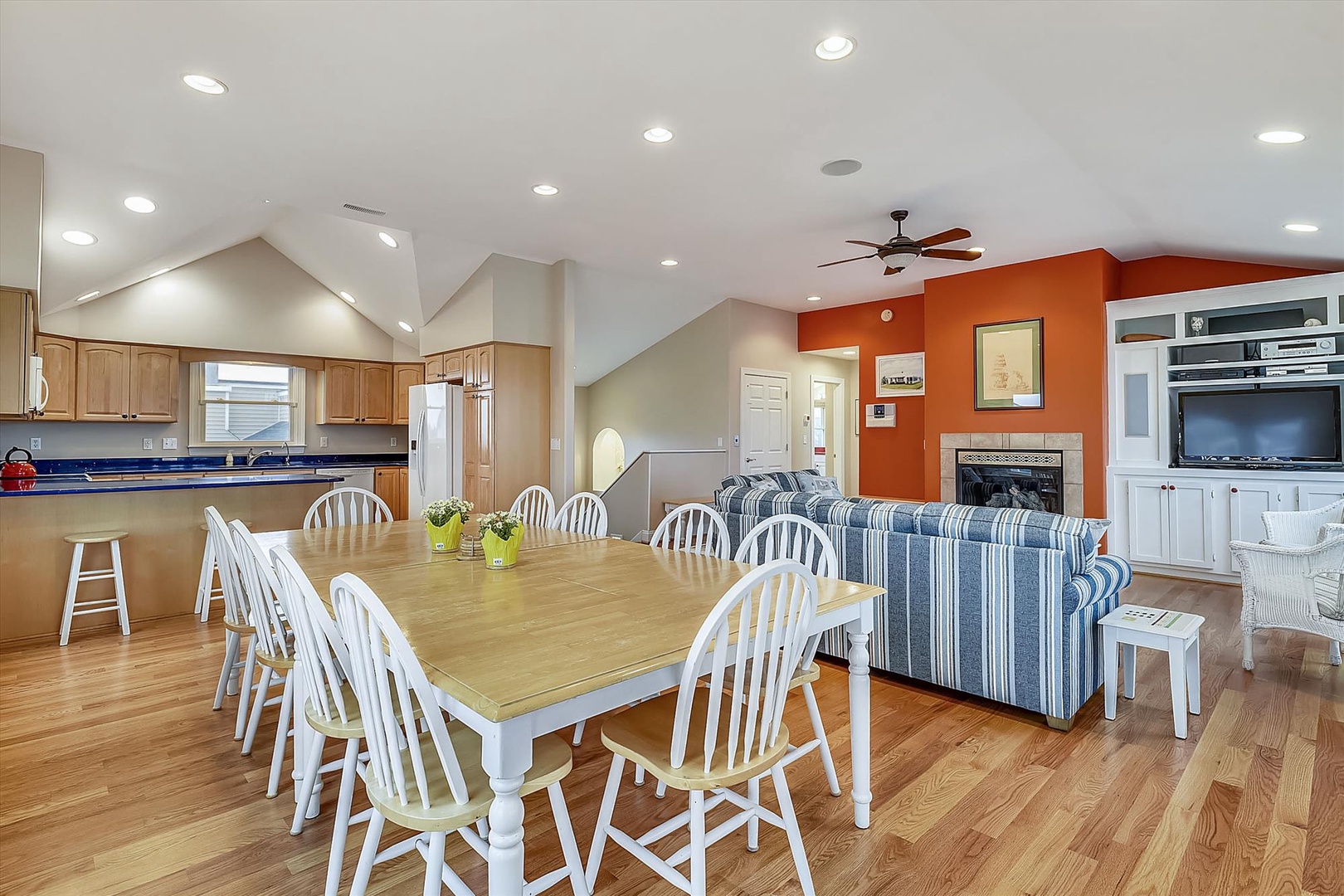 Gather around this spacious dining table where your group can share meals and stories. The open floor plan connects you to the kitchen and living area, perfect for memorable evenings together.