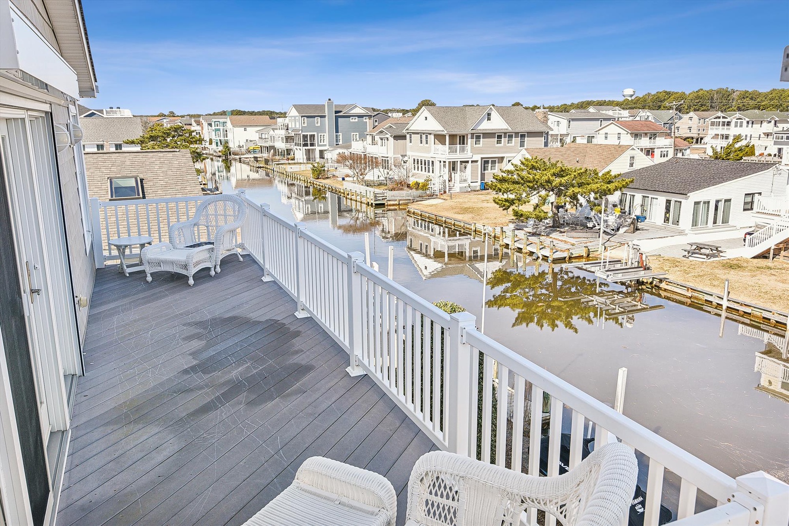 Step onto your private deck to enjoy peaceful waterfront views and comfortable seating overlooking the charming canal community.
