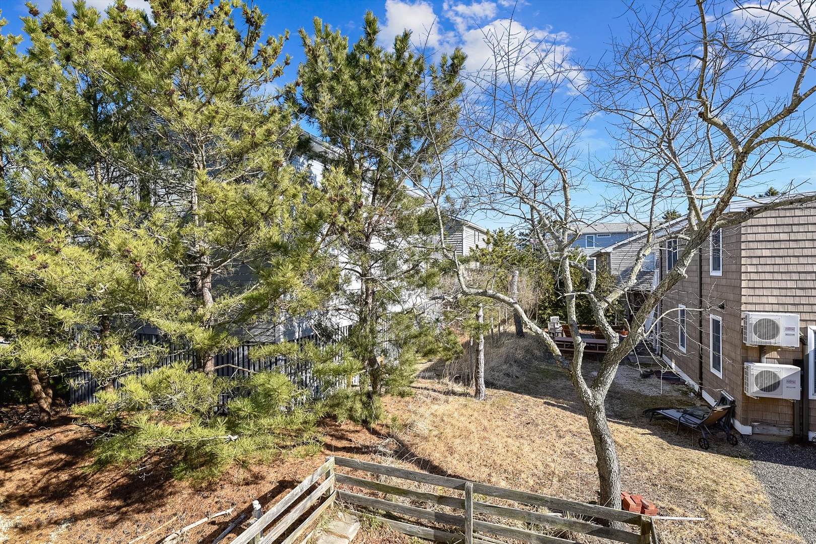 Quiet neighborhood setting surrounded by trees and residential homes, offering a peaceful atmosphere for your stay.